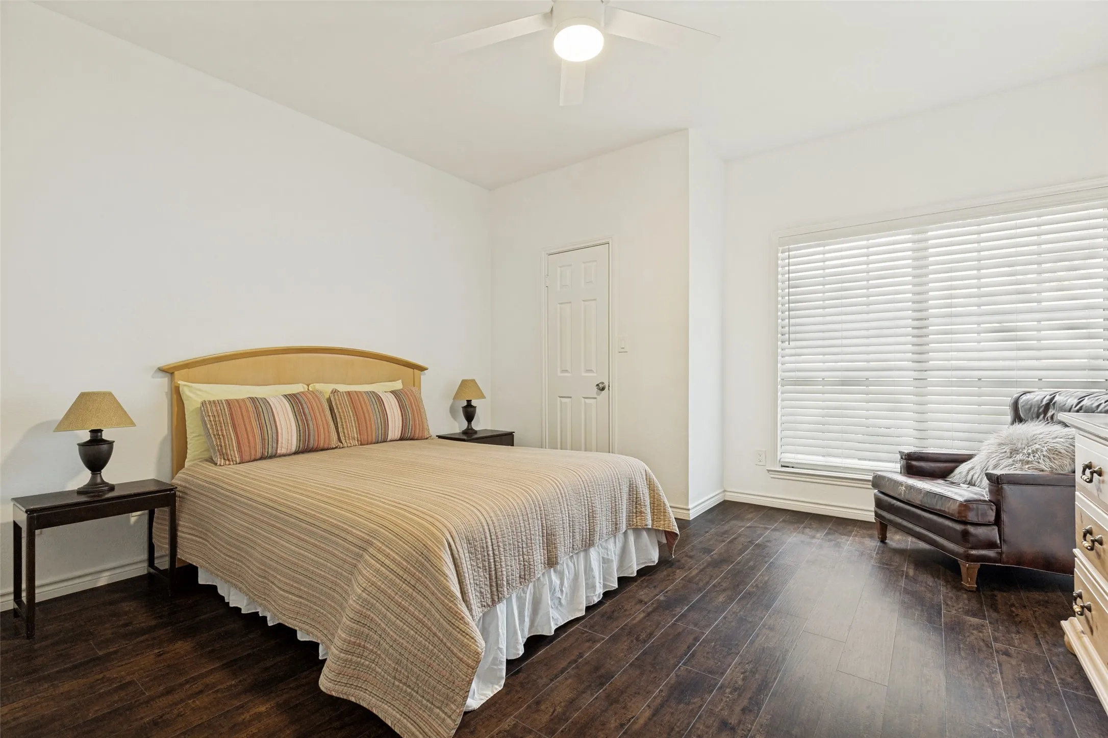 Spacious Primary bedroom with wood floors