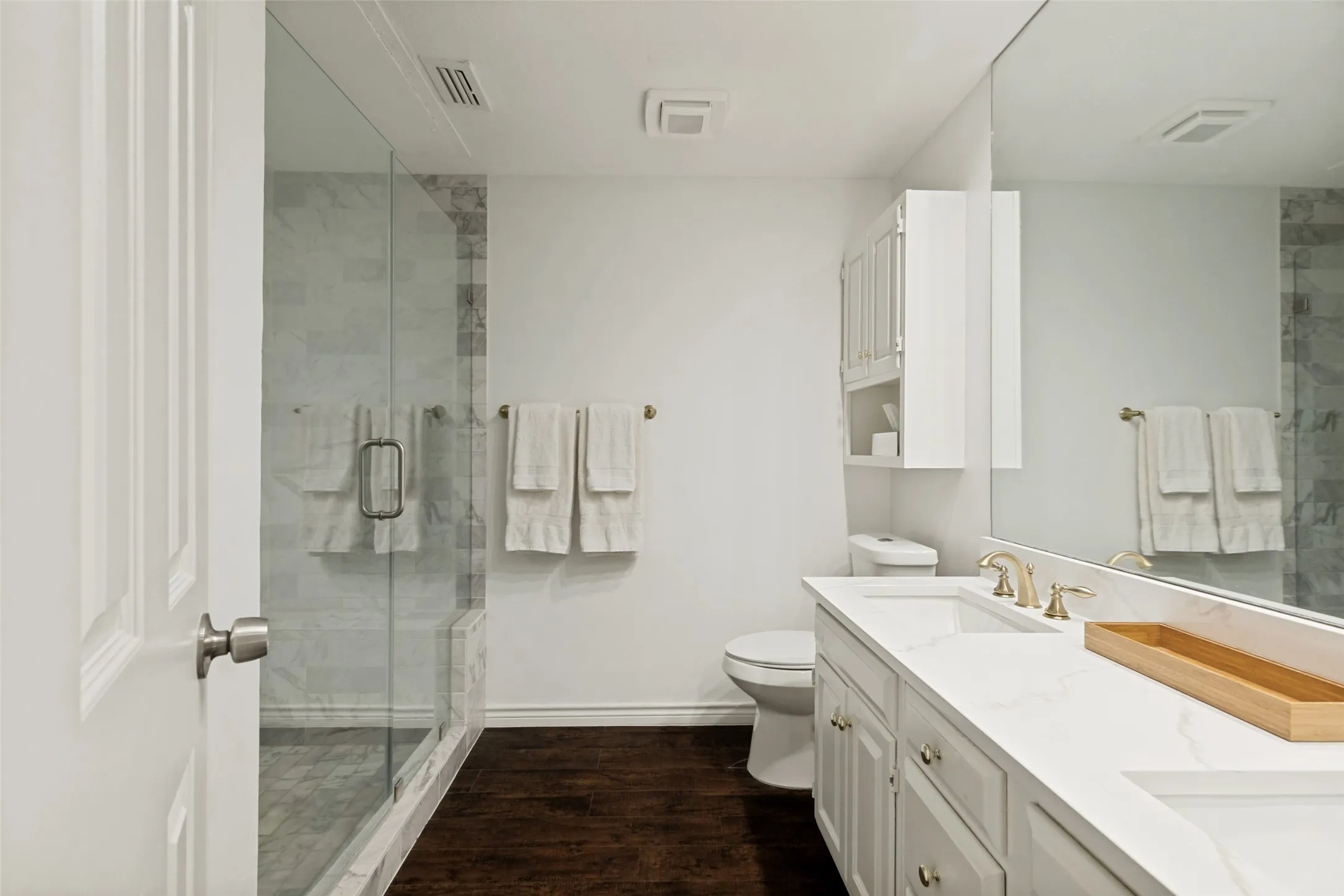 Primary bath with dual vanities and walk-in shower