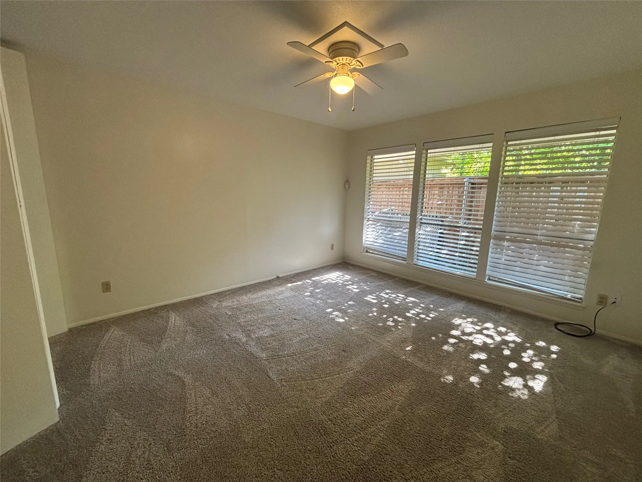 Wall-to-wall carpeting and neutral wall tones