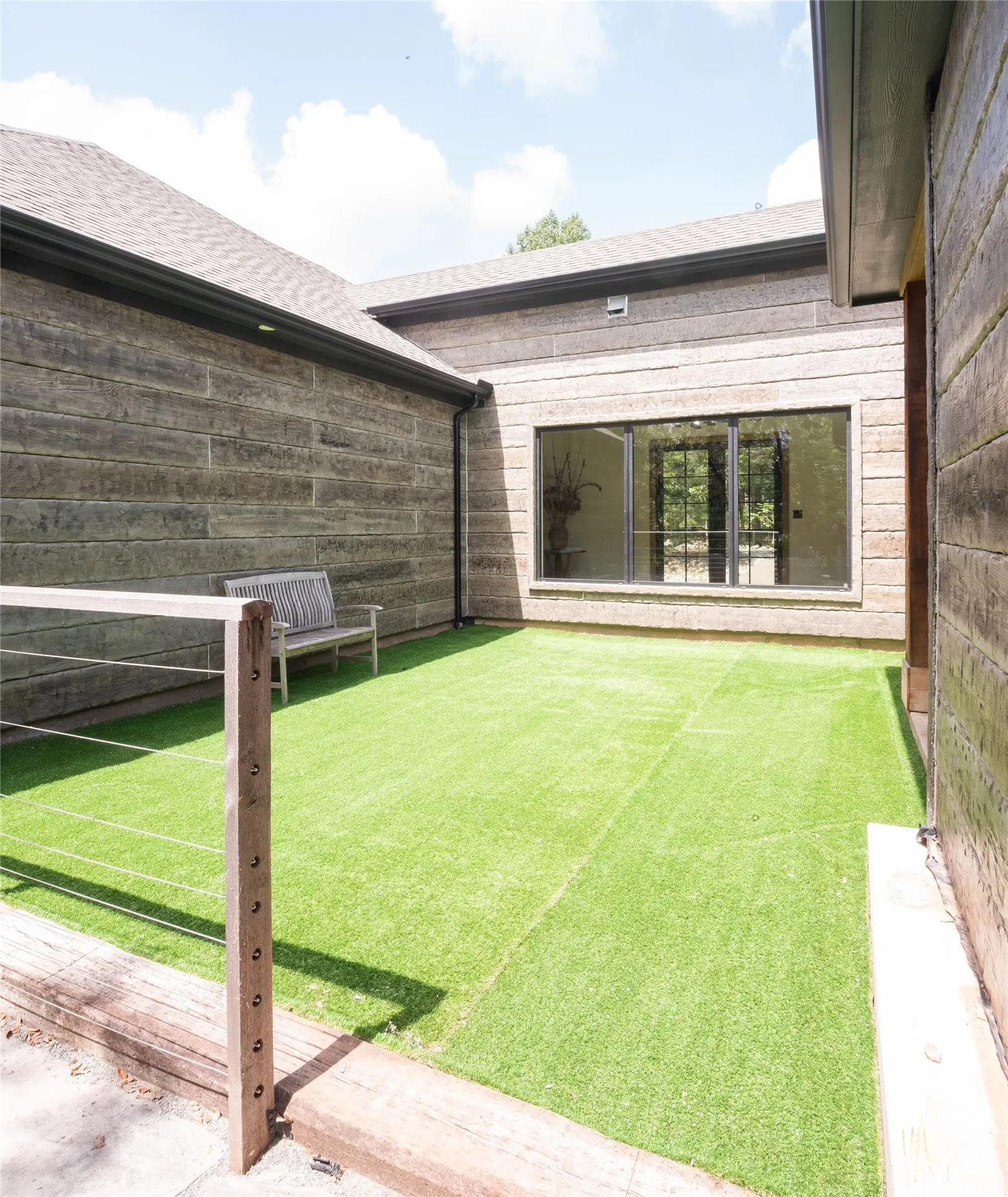 The turfed area is viewd from the front door and easily accessed from the pantry