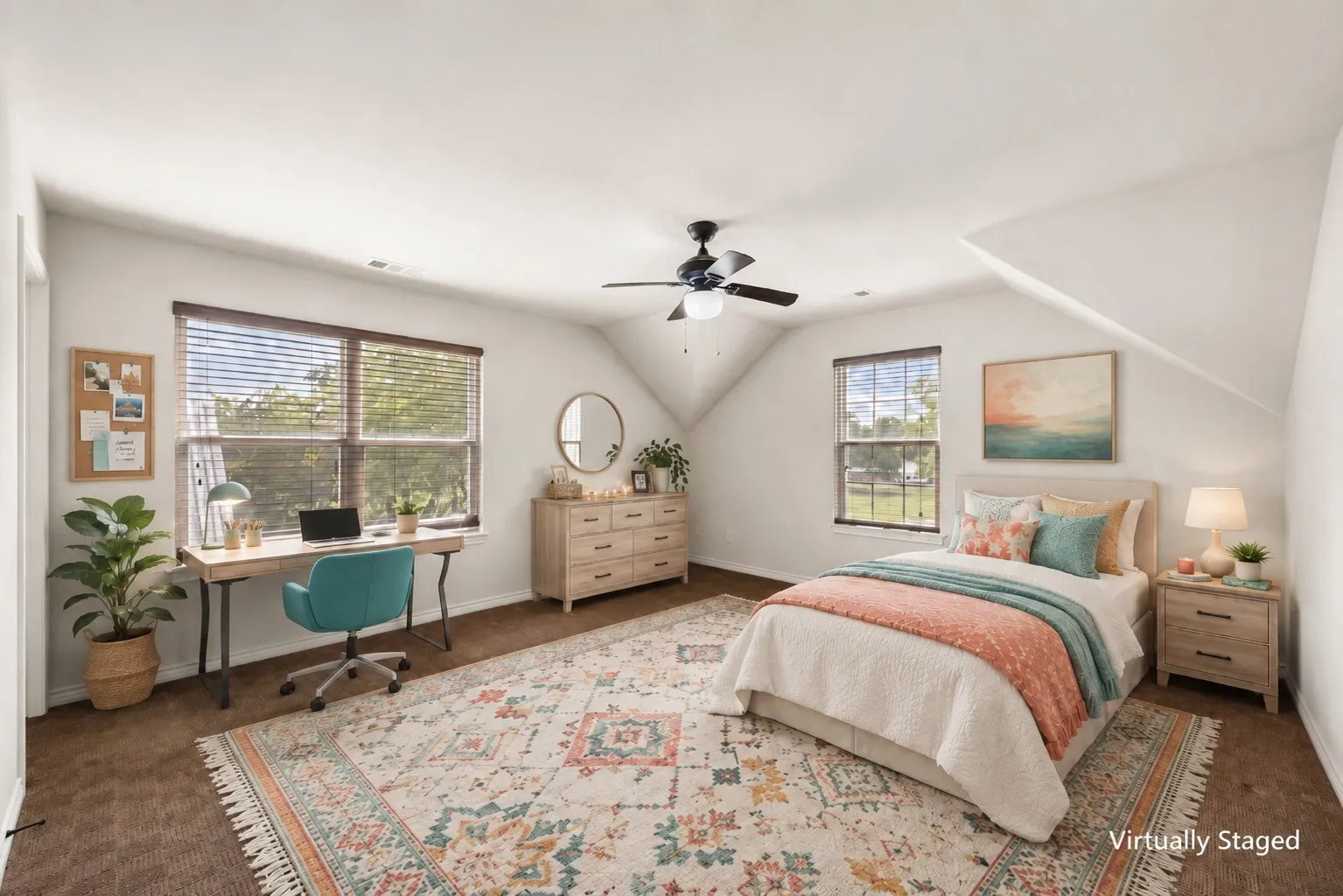 Virtually staged second primary bedroom with twin bed, study desk and lively teal and coral accents.