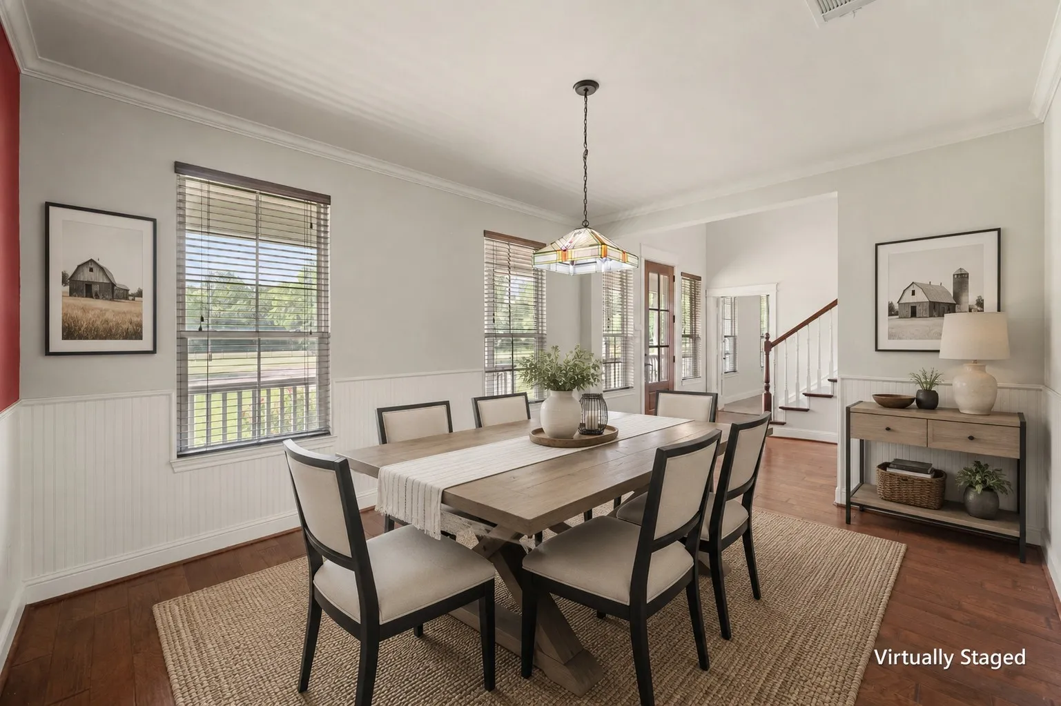 Virtually staged formal dining room with modern farmhouse furnishings and comfortable seating for memorable gatherings.