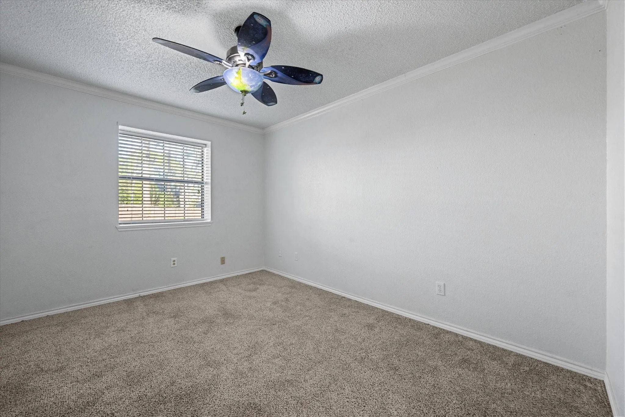 Second Bedroom  Carpeted room featuring a ceiling fan with light fixture, window with horizontal blinds, and white painted walls