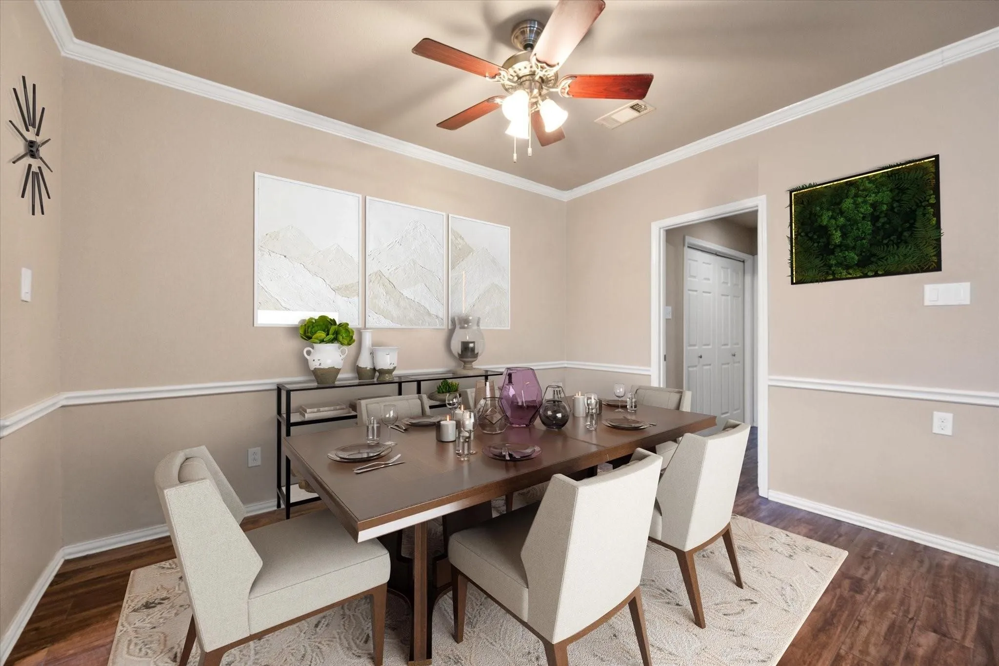 VIRTUALLY STAGED  Spacious living area featuring wood-finish flooring, neutral wall tones, and crown molding