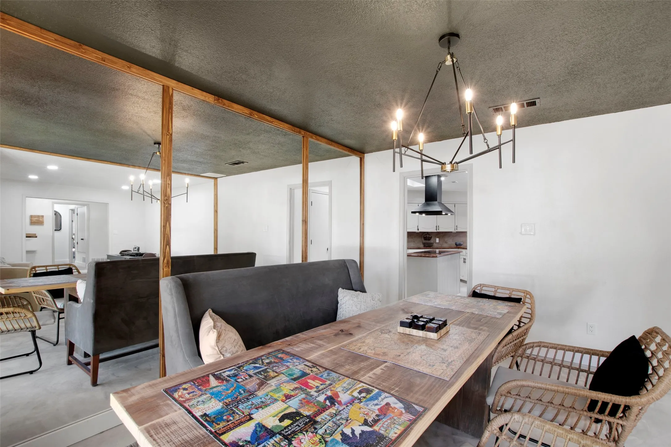 Dining room featuring a textured ceiling and an inviting chandelier
