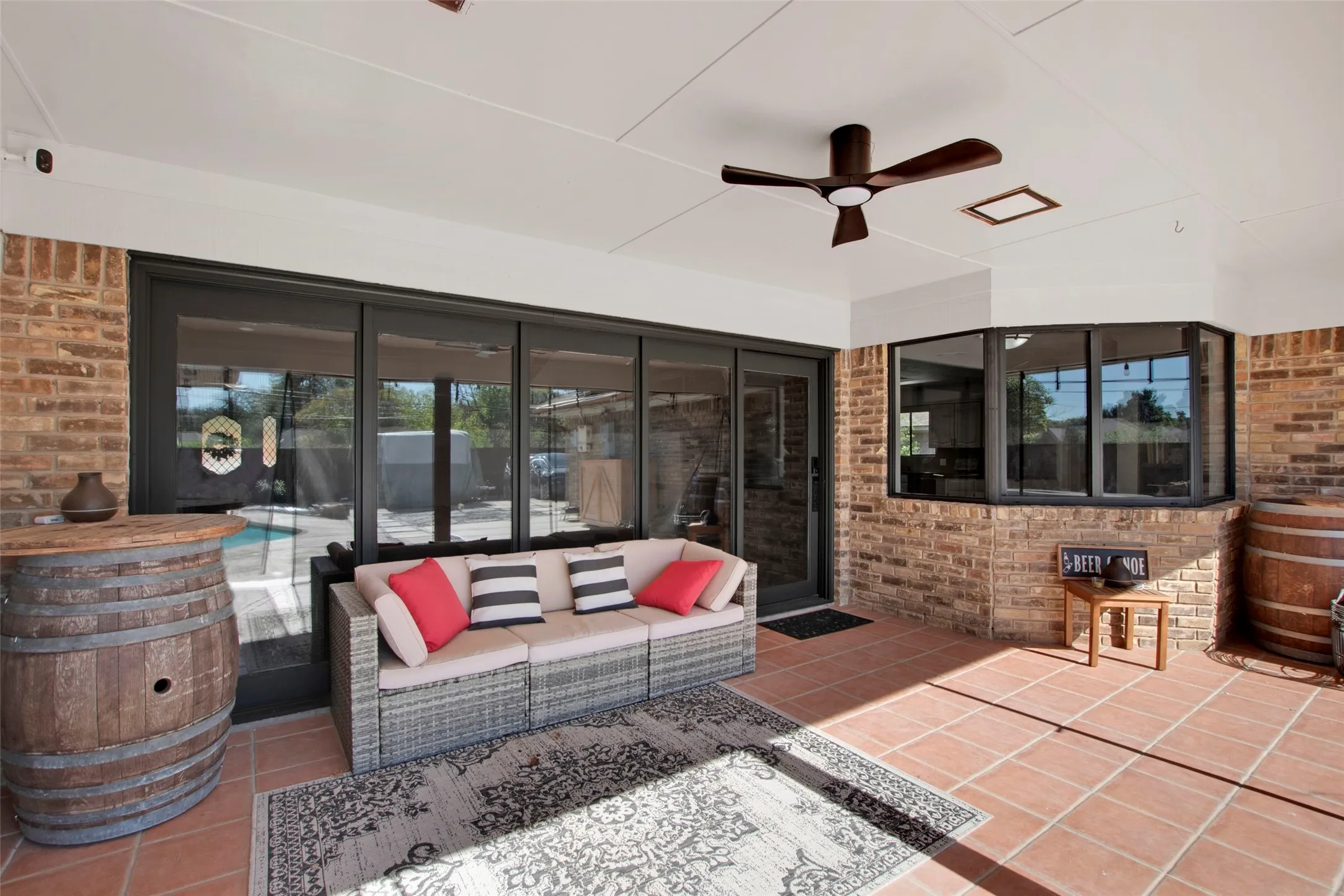 View of patio with ceiling fan and an outdoor hangout area
