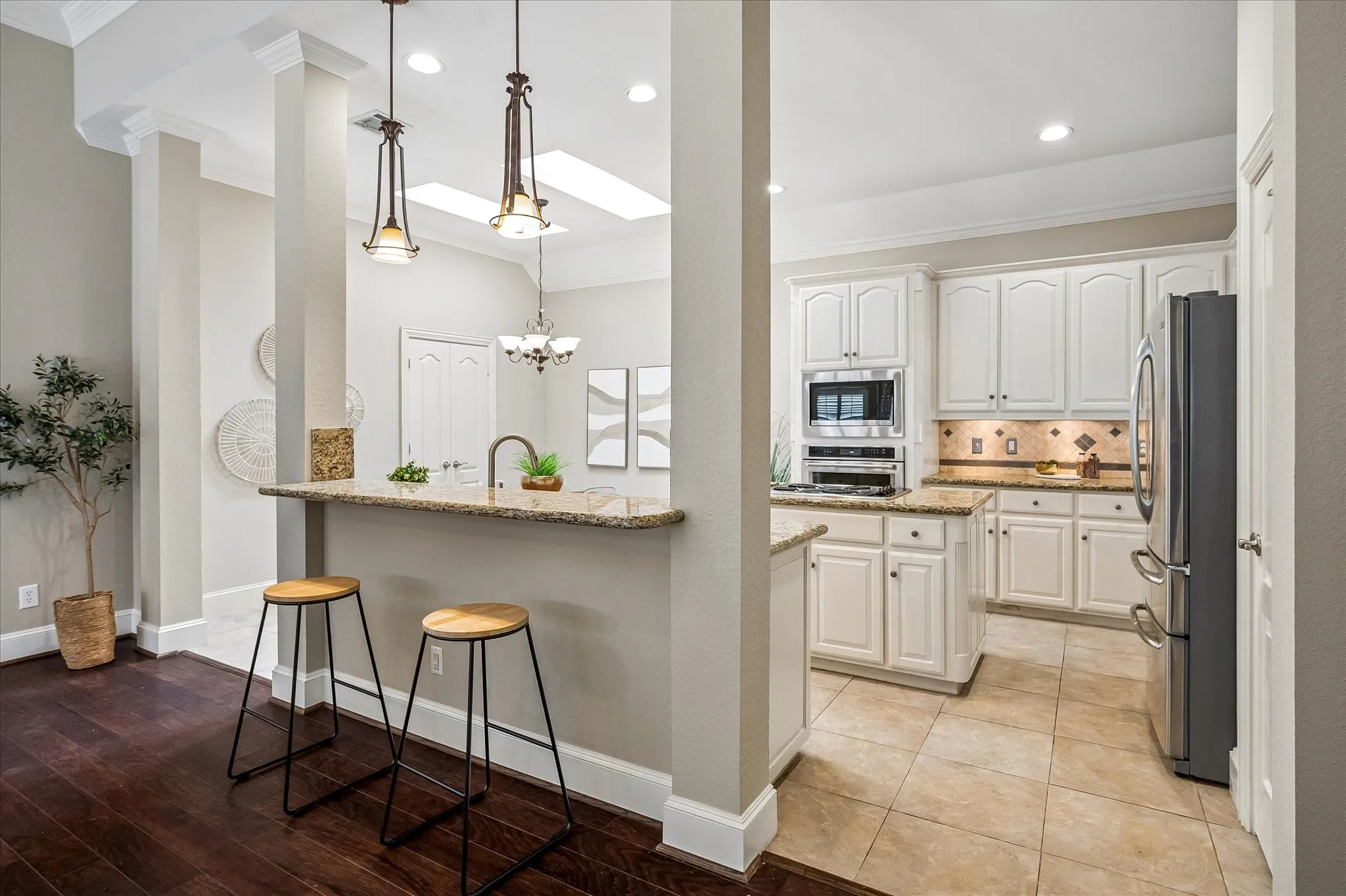 Kitchen bar with pendant lighting.