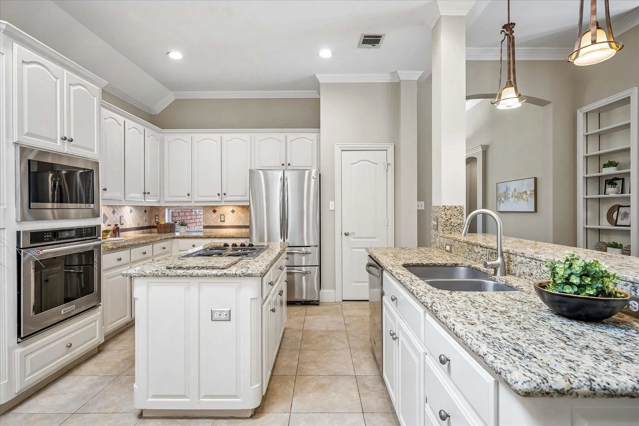 Kitchen has granite counters and center island.