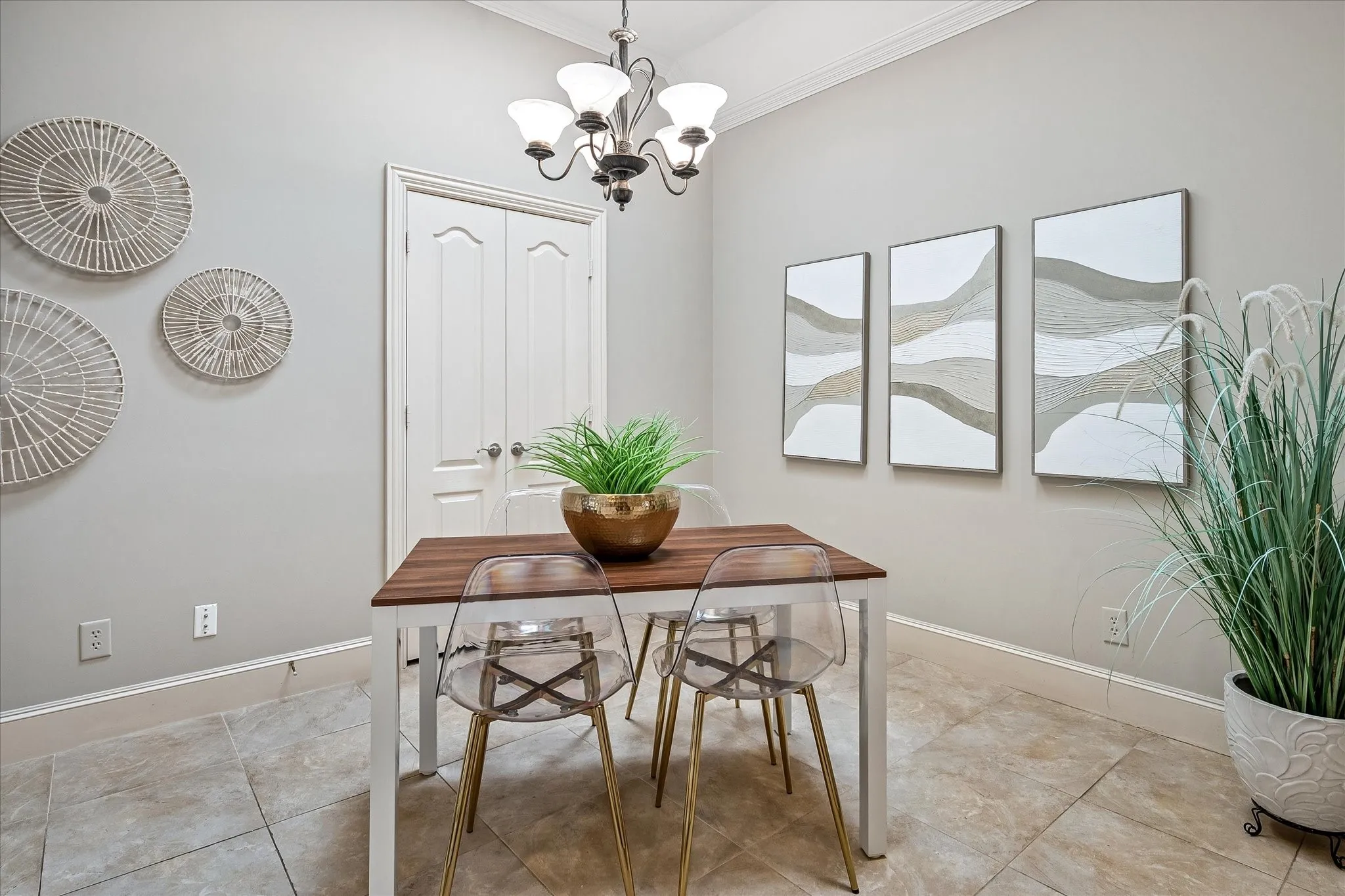 Breakfast area opens to laundry room, supporting both electric or gas dryer,  additional cabinets and shelved closet.
