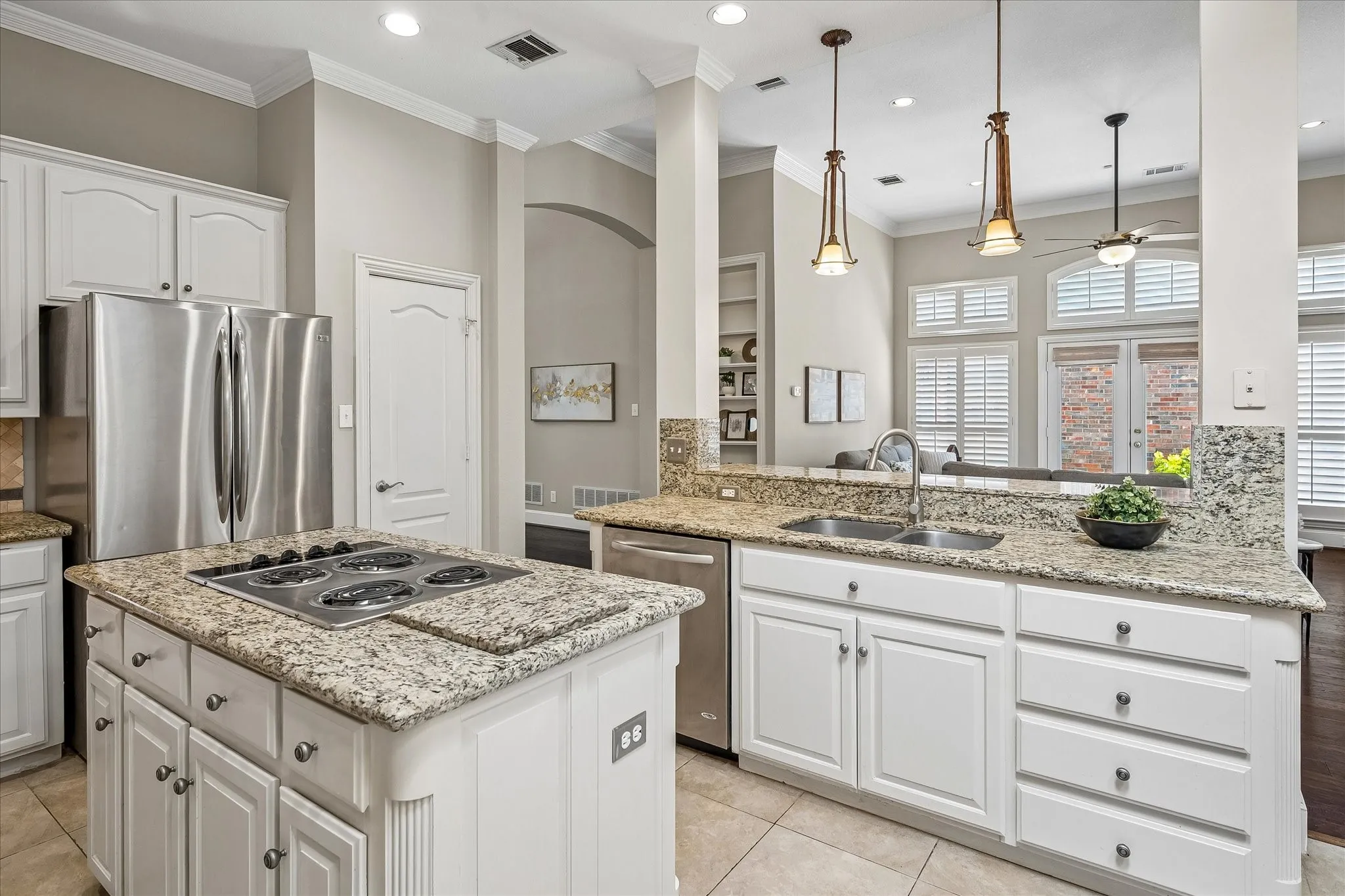 Another kitchen view with door to pantry.