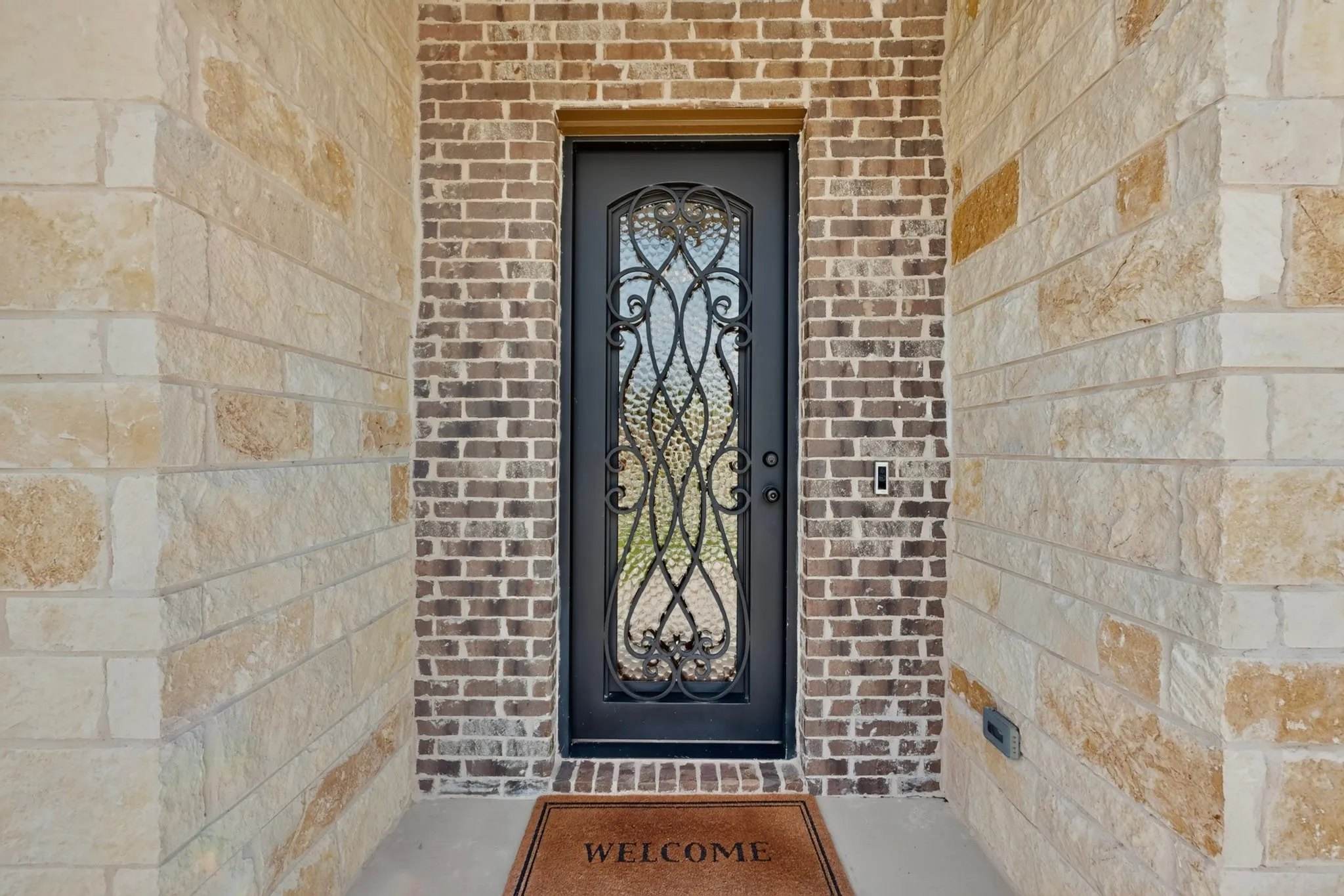 Covered patio and an iconic iron door entry begin your experience.