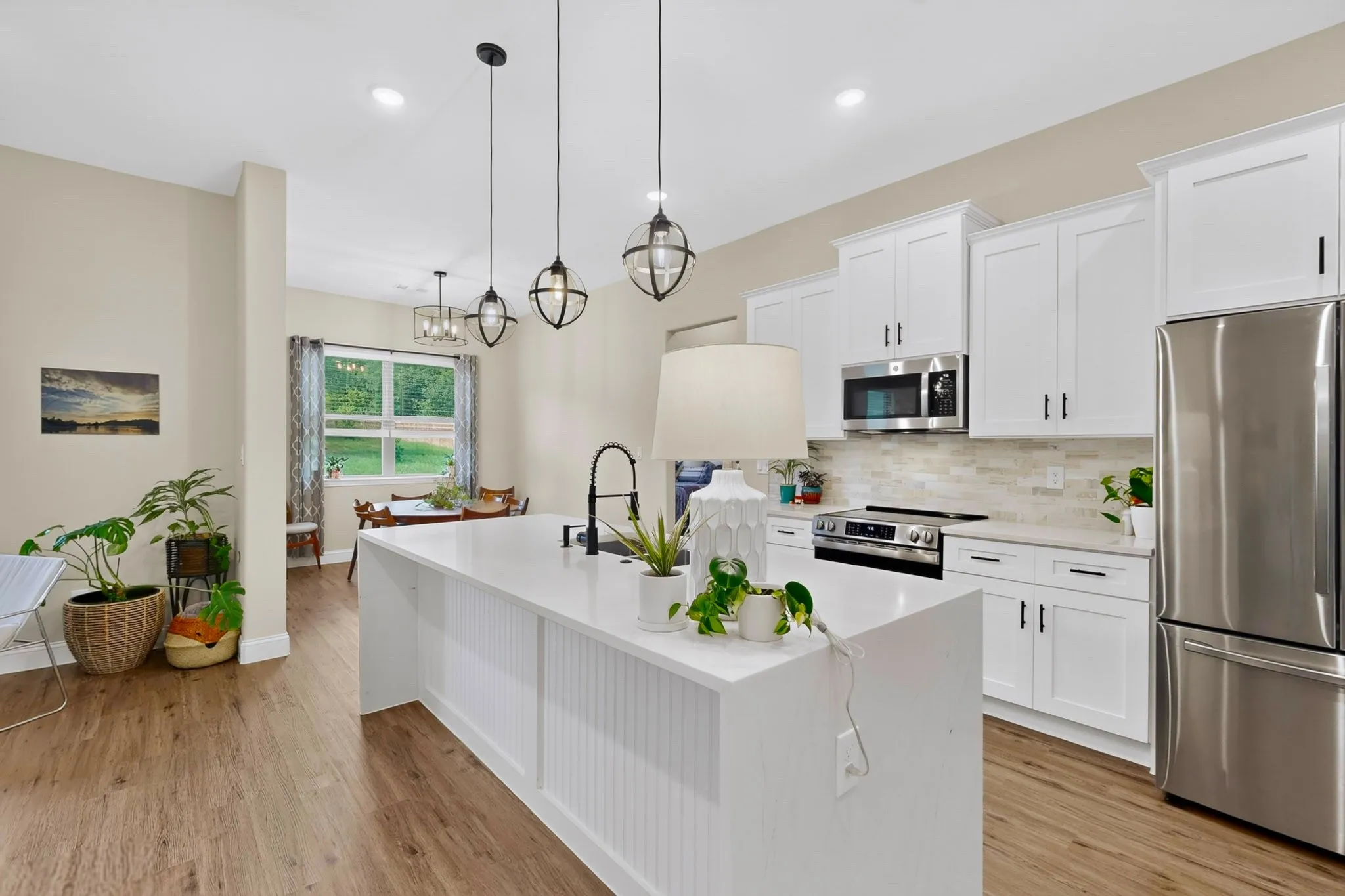 Charming black accents, pendants and nearly new appliances.