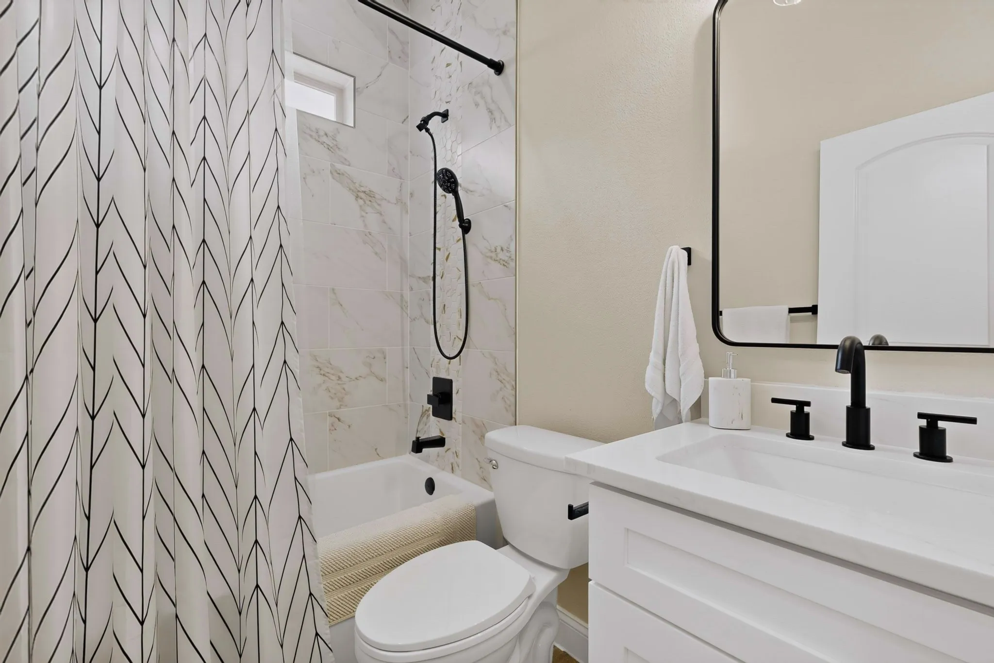 Notice the tile details and class in the shared hall bath.