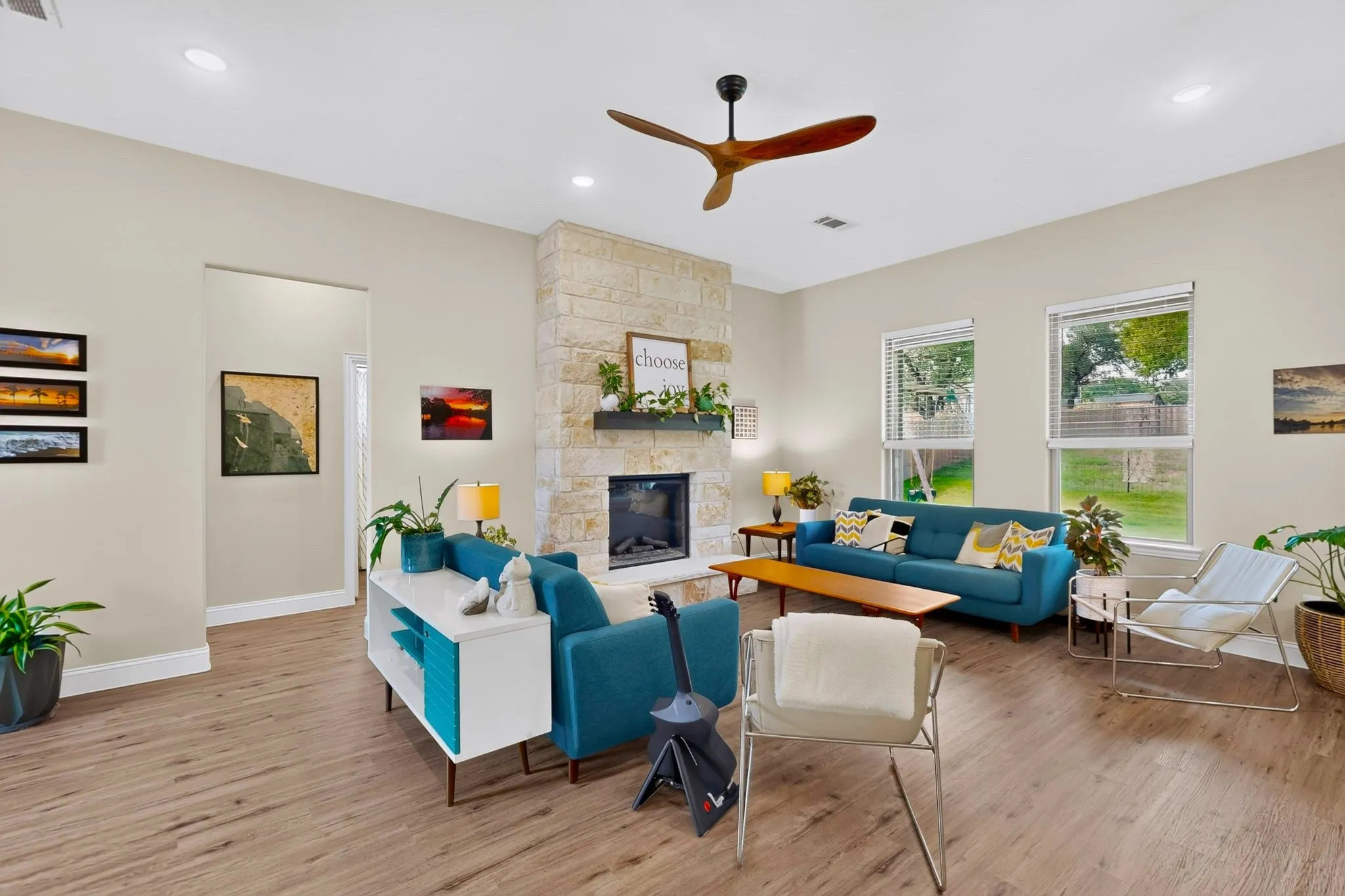Anchored by a full stack of limestone, the fireplace adds ambiance near the west bedroom wing of the home.