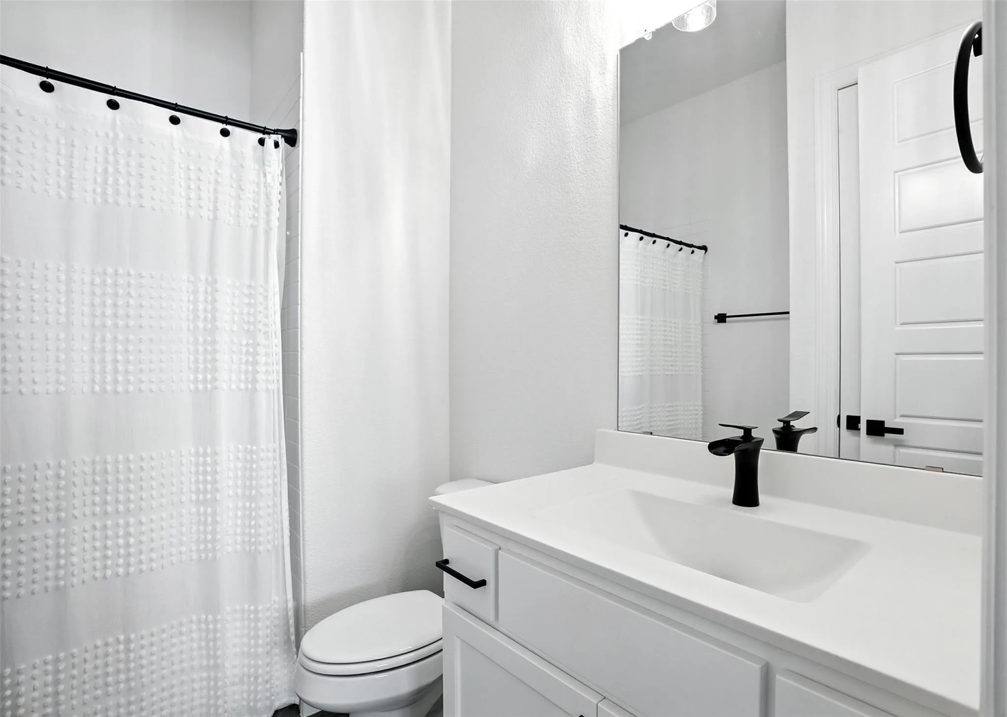 Bathroom featuring vanity and a shower with curtain