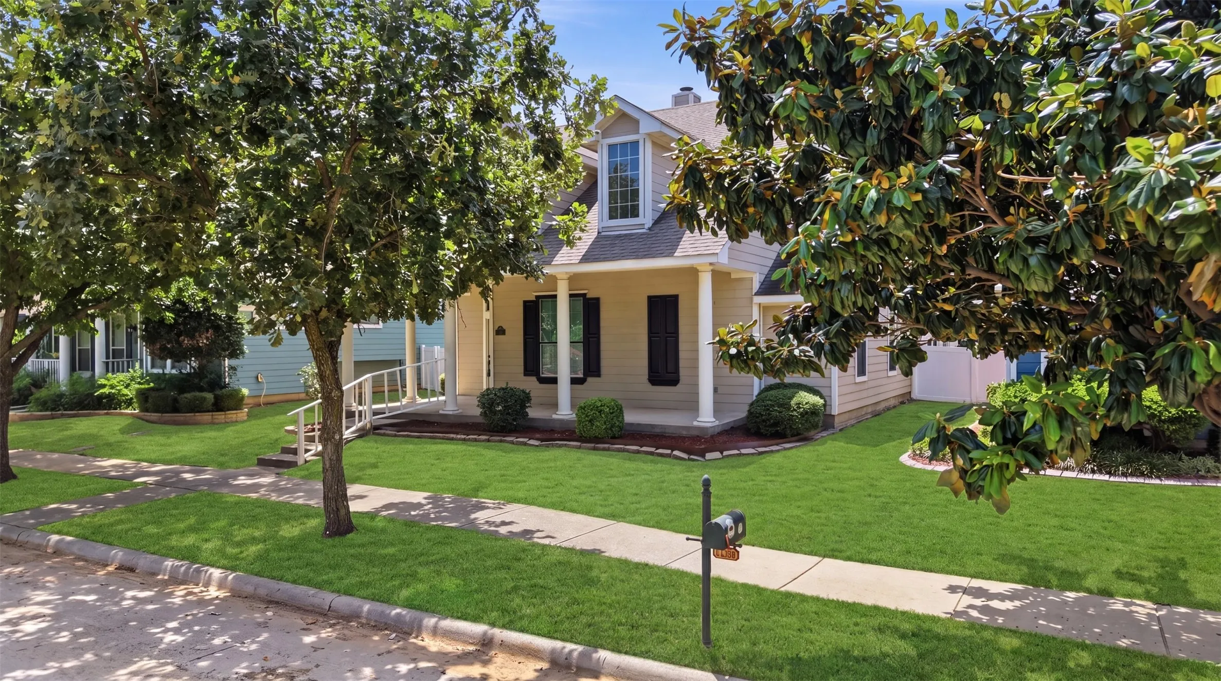 Meticulously maintained exterior with manicured landscaping, established trees, and an inviting streetscape that enhances the home's overall appeal.