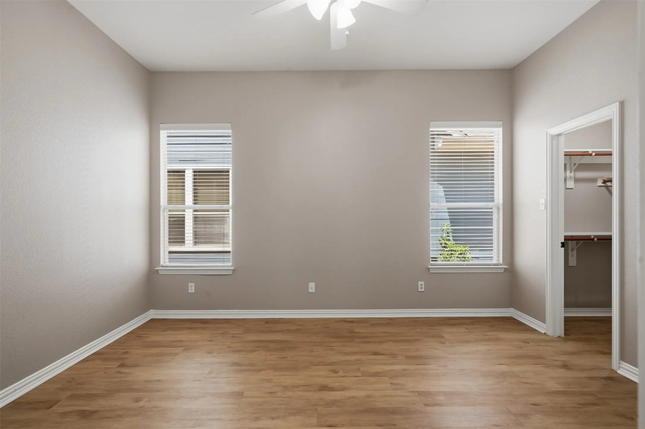 Large walk-in closet provides ample storage space for clothing, shoes, and personal belongings.