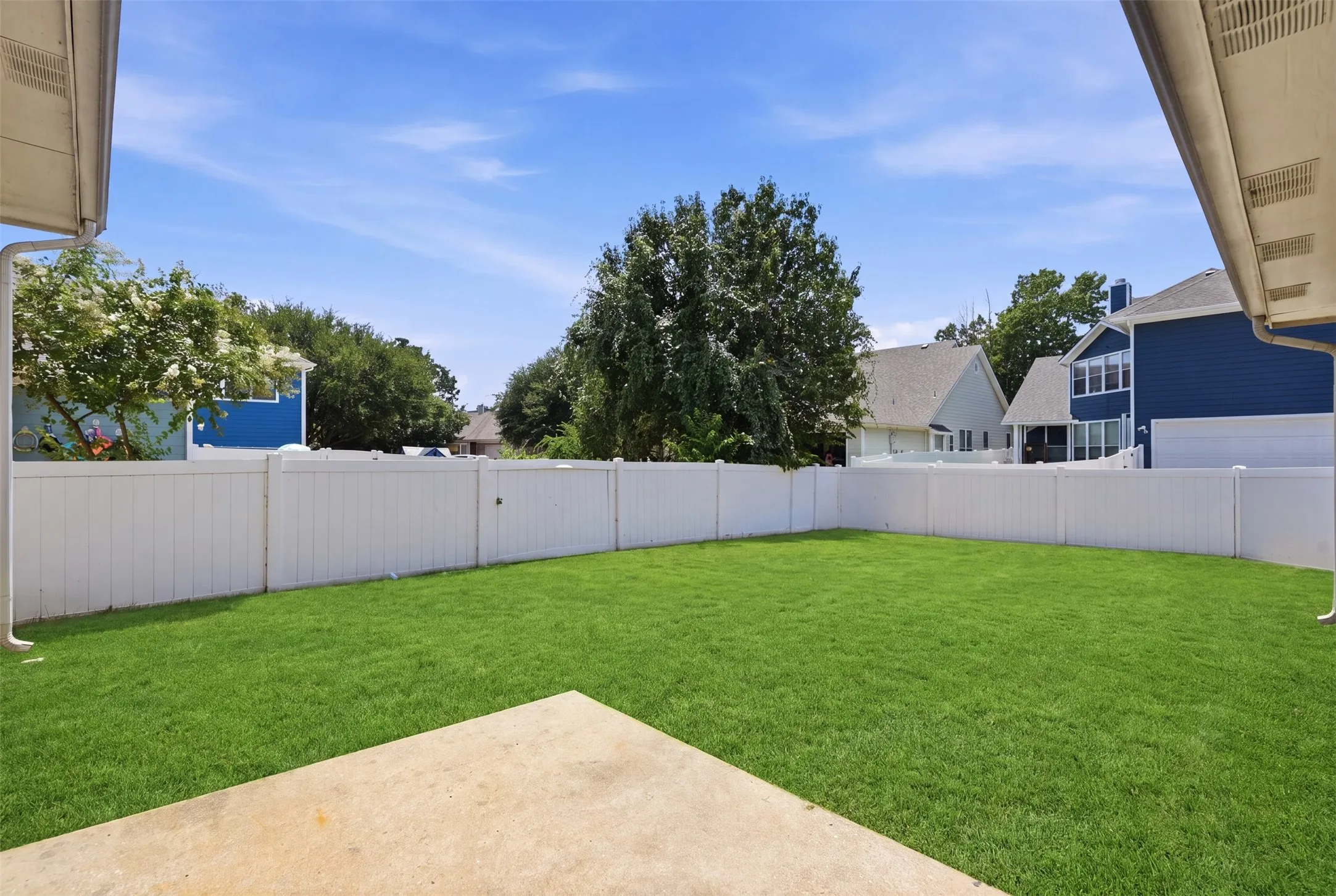 Expansive, fully fenced backyard offers privacy and plenty of room for outdoor activities, pets, or play.