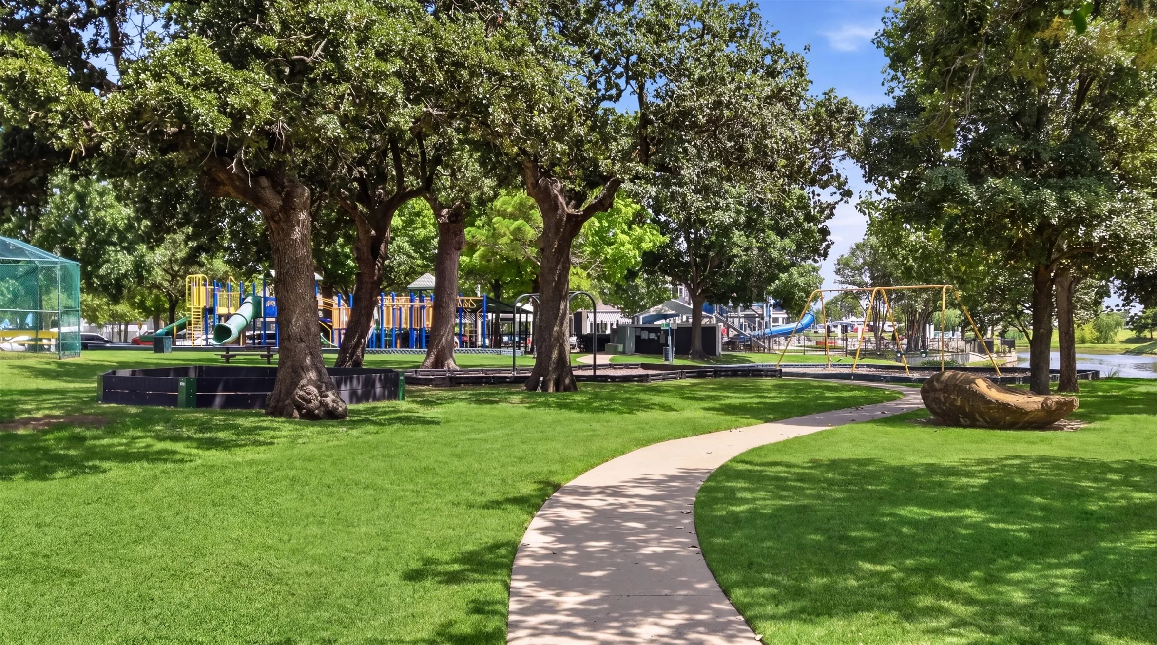 Mature trees, open green areas, and walking paths create a peaceful environment to relax and enjoy the outdoors.