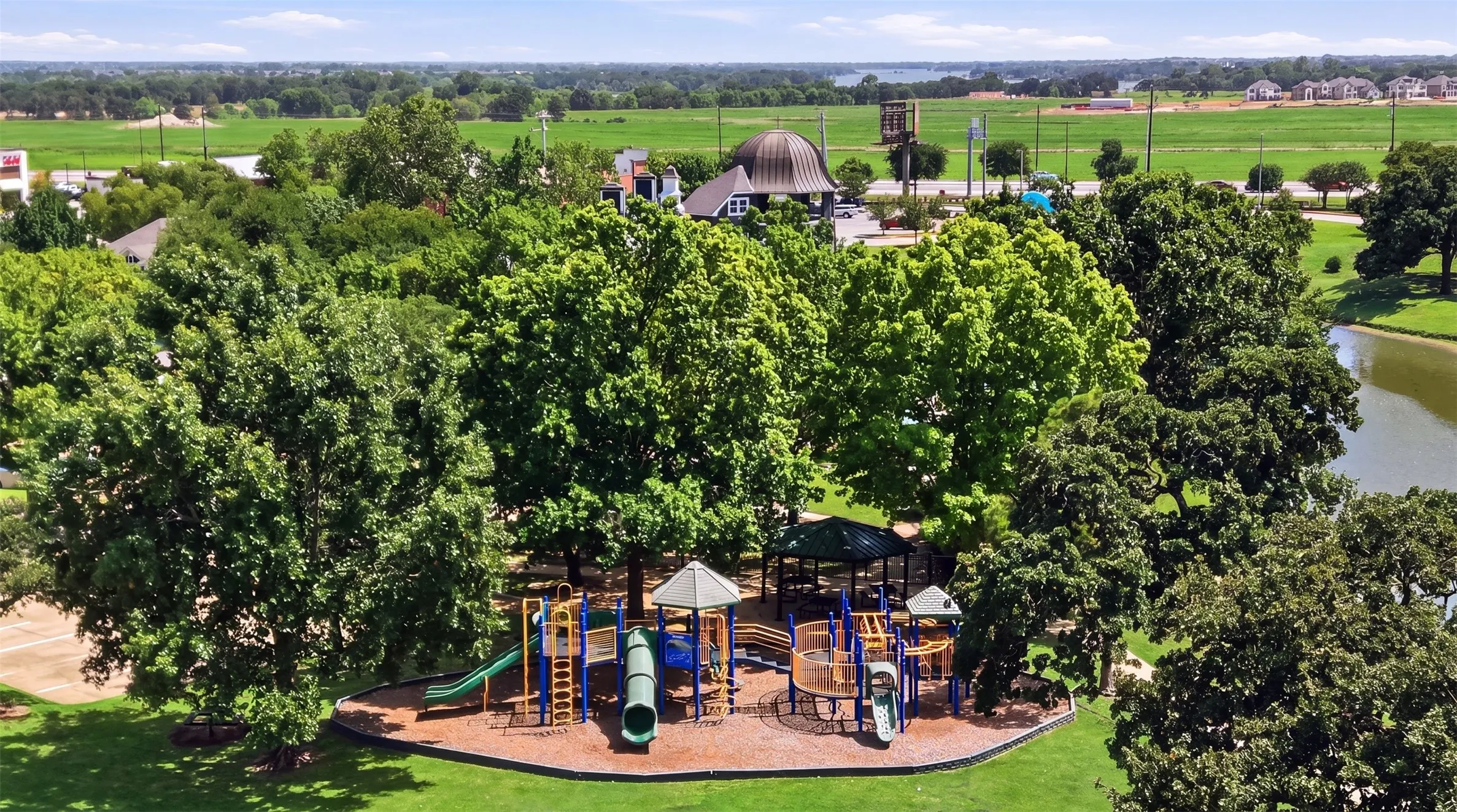 Community pond and surrounding green space provide a picturesque setting for walking, picnics, and enjoying nature.