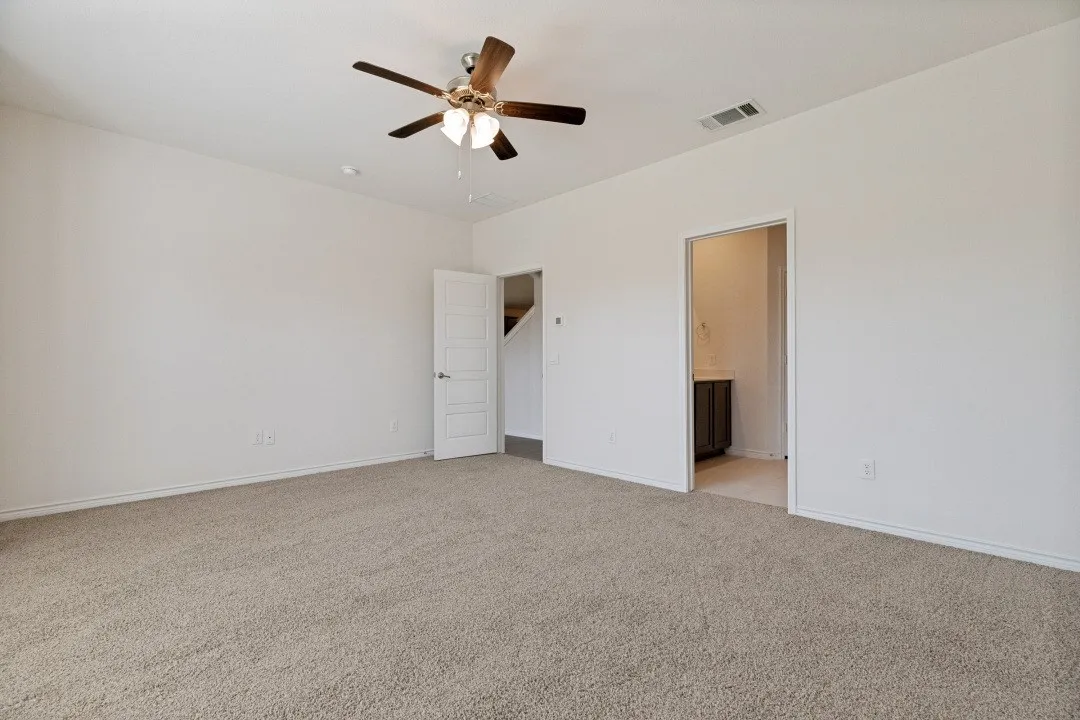 Neutral-toned carpeting throughout