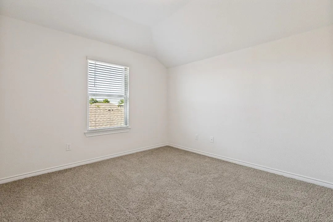 Room featuring neutral wall finishes and a single window with blinds