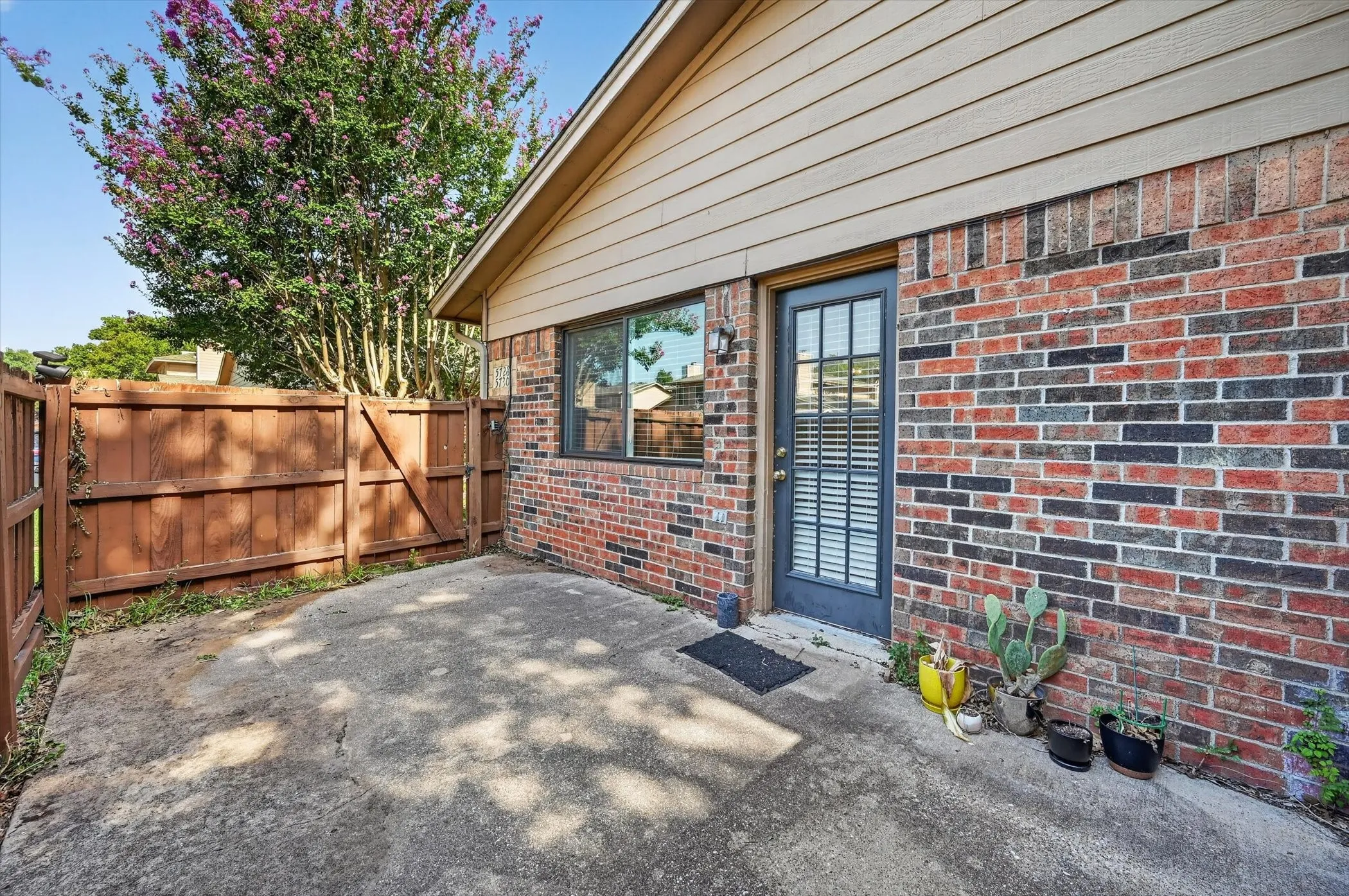 Private outdoor patio with privacy fencing and direct entry