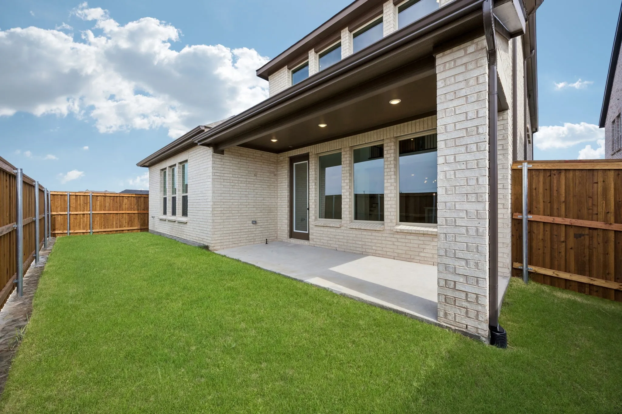 The entire family will enjoy plenty of outdoor summer time fun in this fenced back yard with covered back patio!