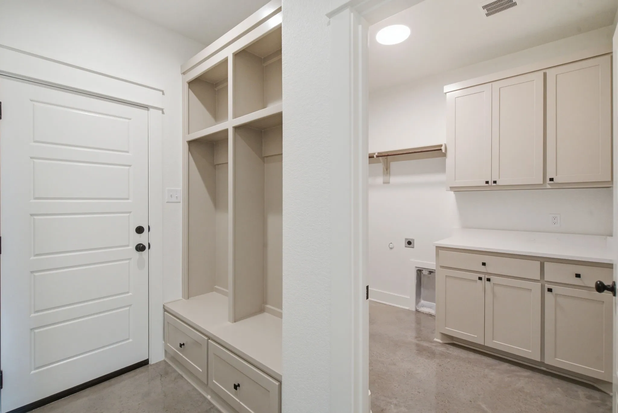 Built-in mudroom bench with storage cubbies and drawers