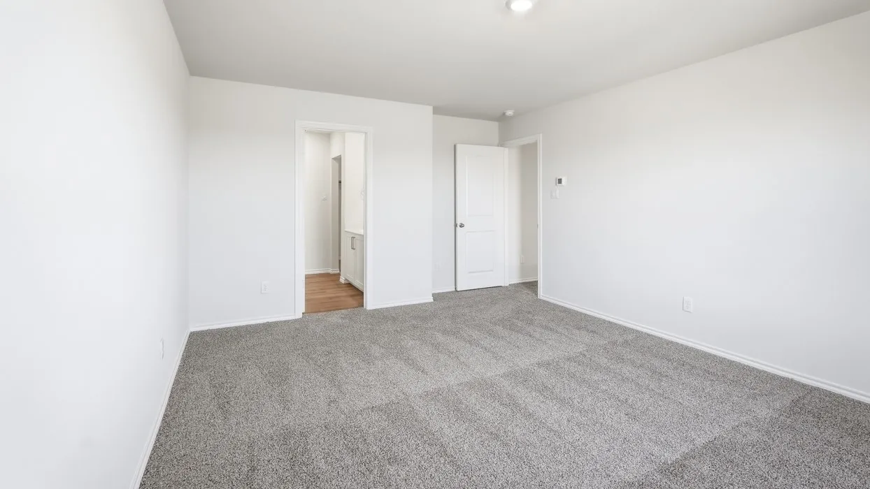 Spacious room with light gray carpet flooring and white painted walls