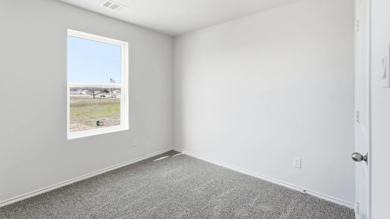 Room featuring light gray painted walls, a single-pane window, and light gray carpet flooring