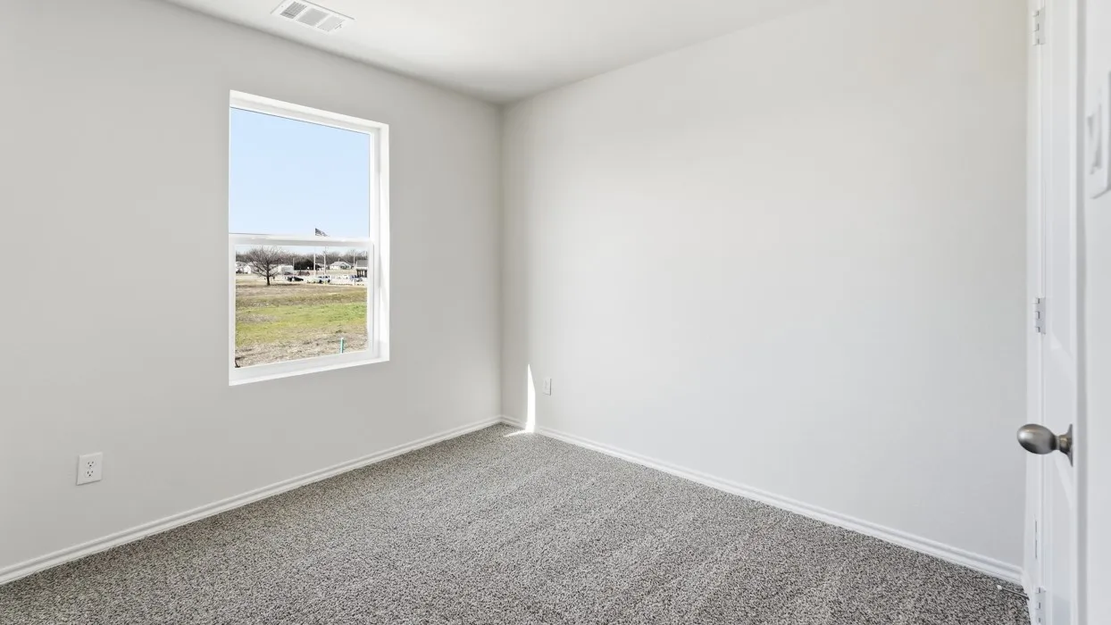 Room featuring light grey carpeting, white painted walls, white trim, and a white framed window