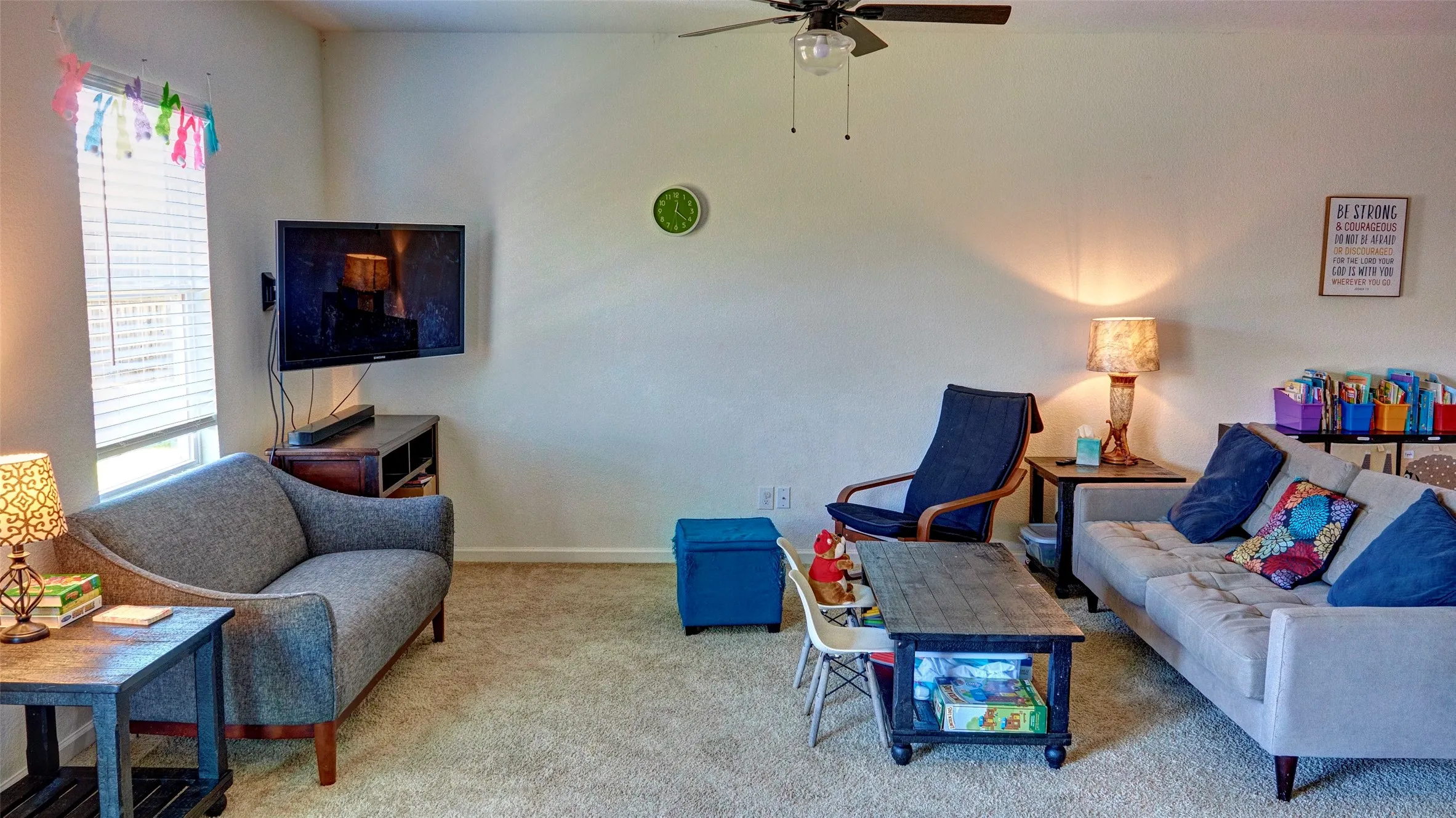 Carpet flooring, ceiling fan, and window with blinds