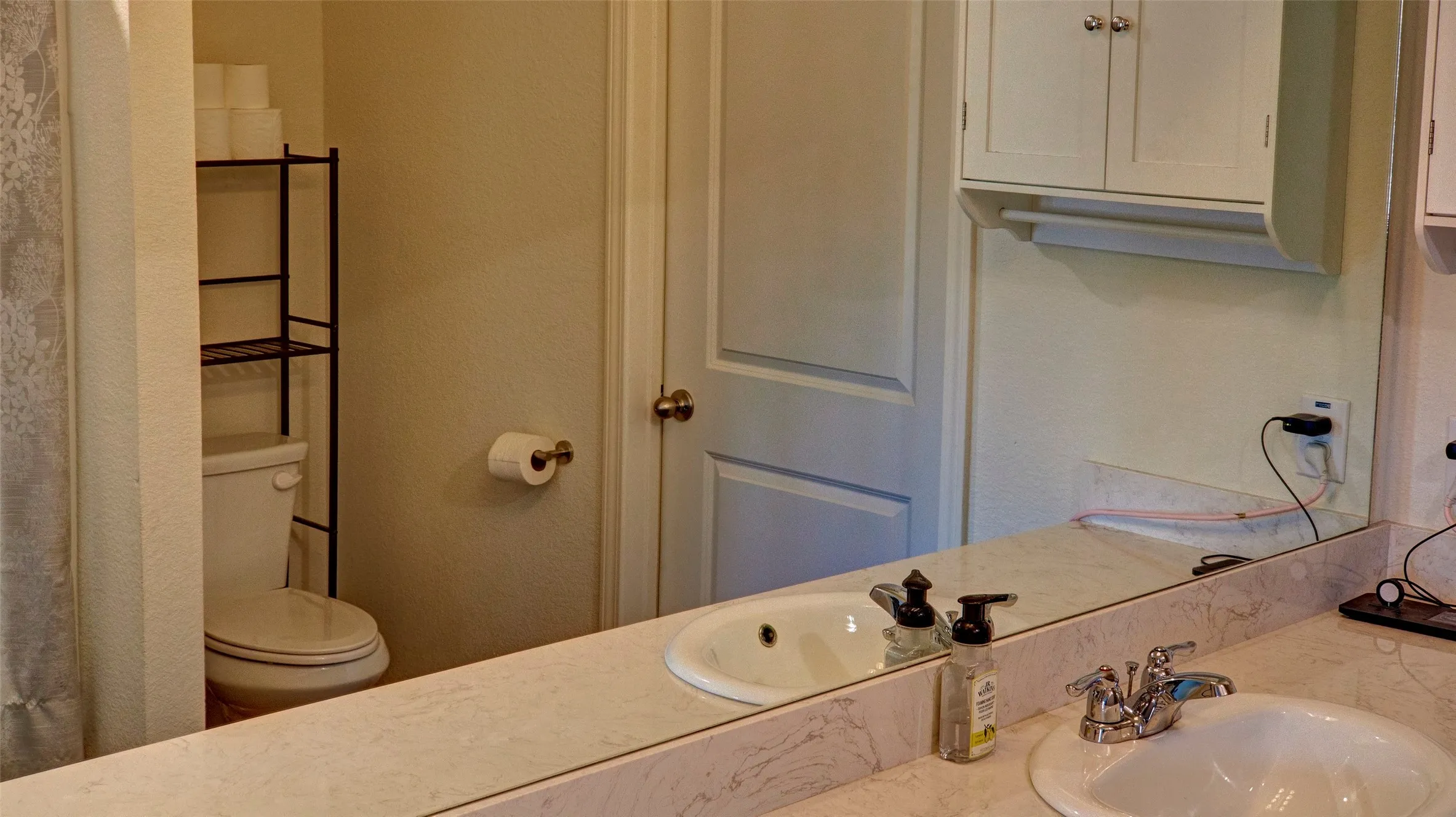 Dual vanity with integrated sinks and chrome fixtures