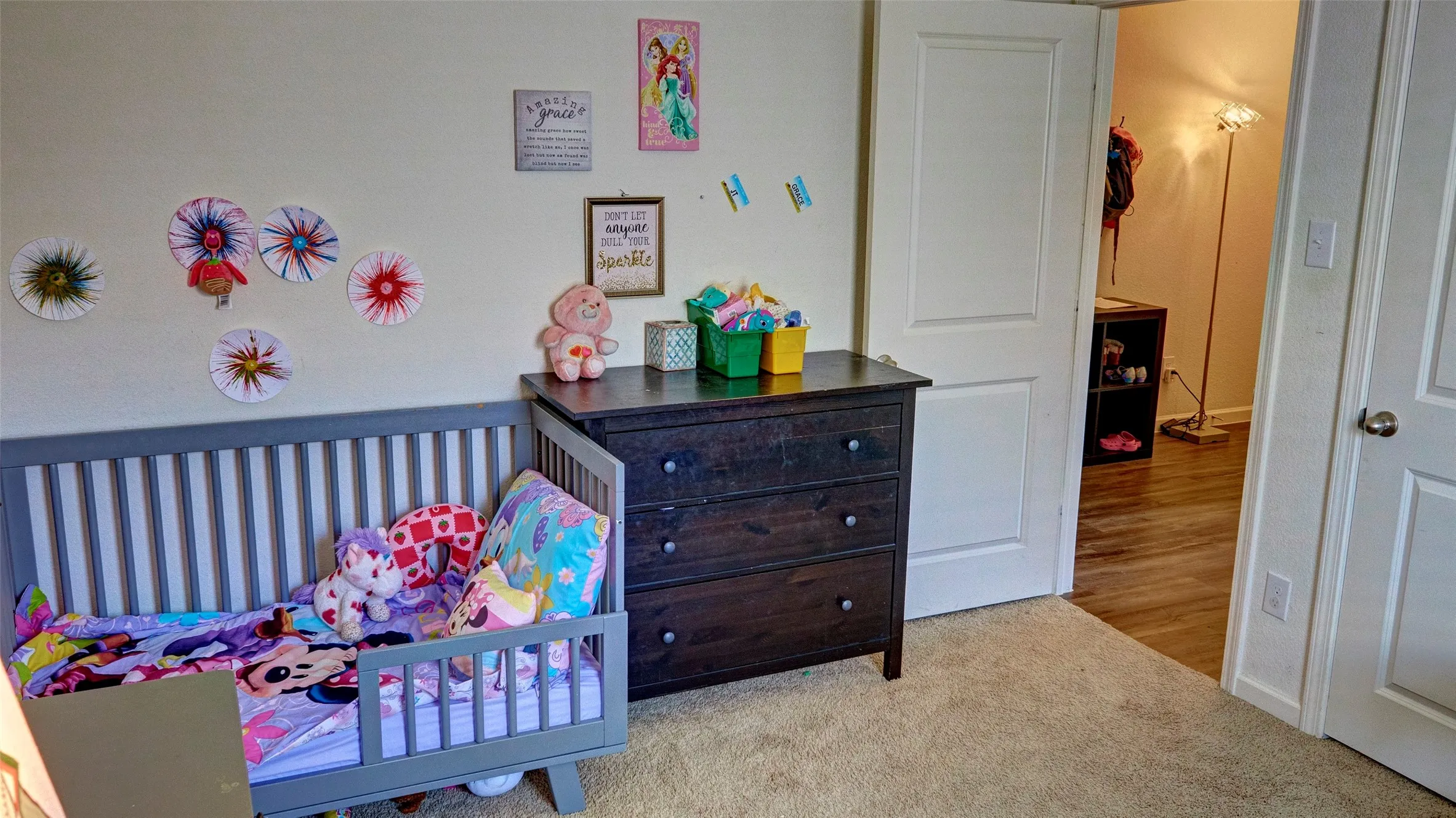 Carpeted flooring, white interior doors, and a neutral wall color