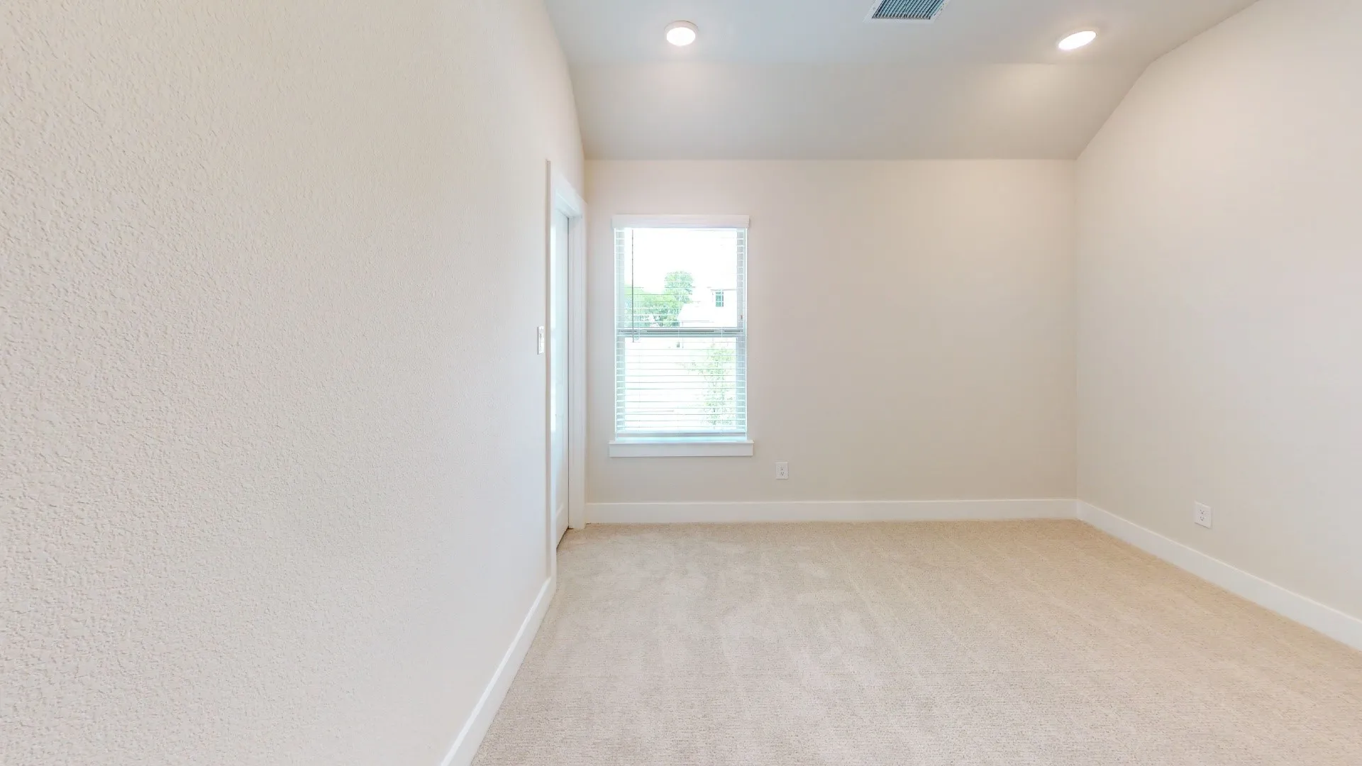 Neutral-toned carpeting throughout