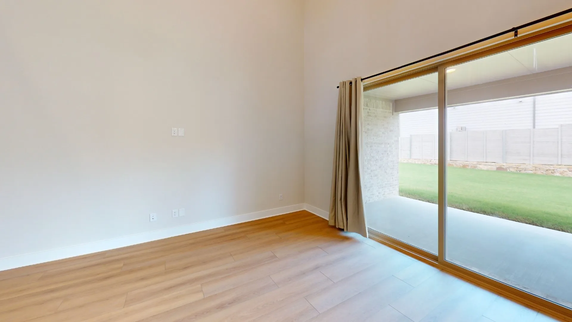 Wood-finish flooring and light-toned walls provide a neutral backdrop