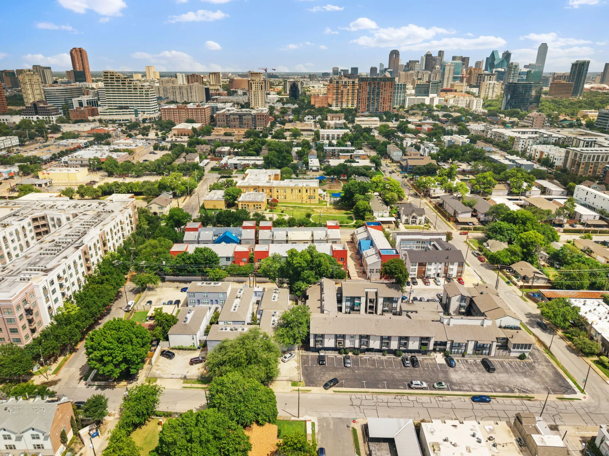 Aerial perspective showcasing urban density with a prominent city skyline