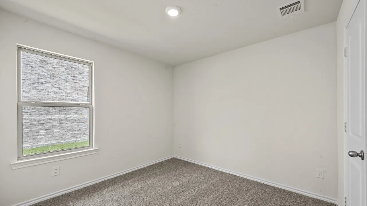 Neutral wall tones with a window offering exterior views