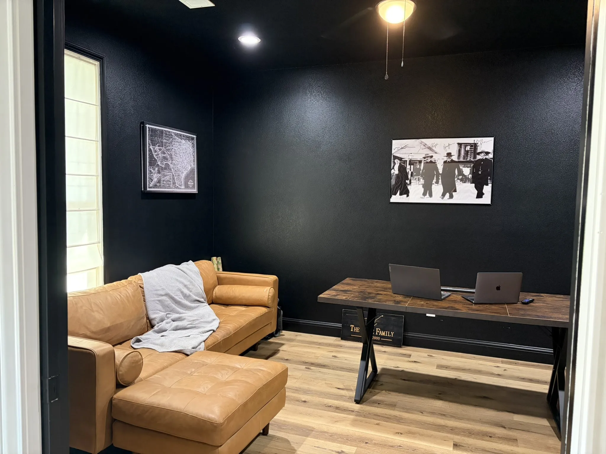 Dedicated room featuring dark painted walls and ceiling, wood-finish flooring, a recessed ceiling light, and a ceiling fan with light fixture