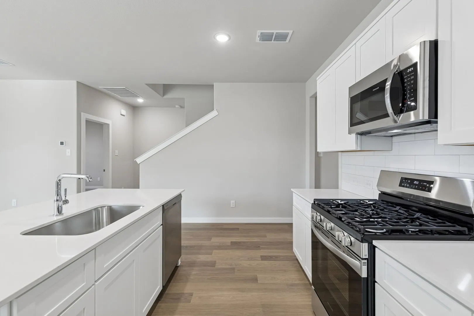 Kitchen in the Holden home plan by Trophy Signature Homes – REPRESENTATIVE PHOTO