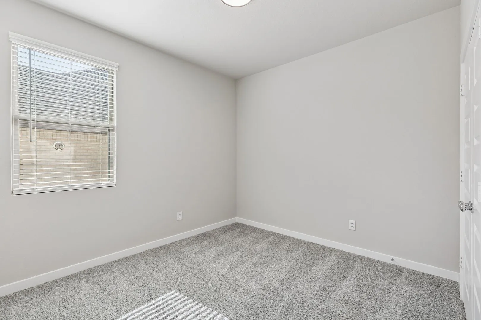 Bedroom in the Holden home plan by Trophy Signature Homes – REPRESENTATIVE PHOTO