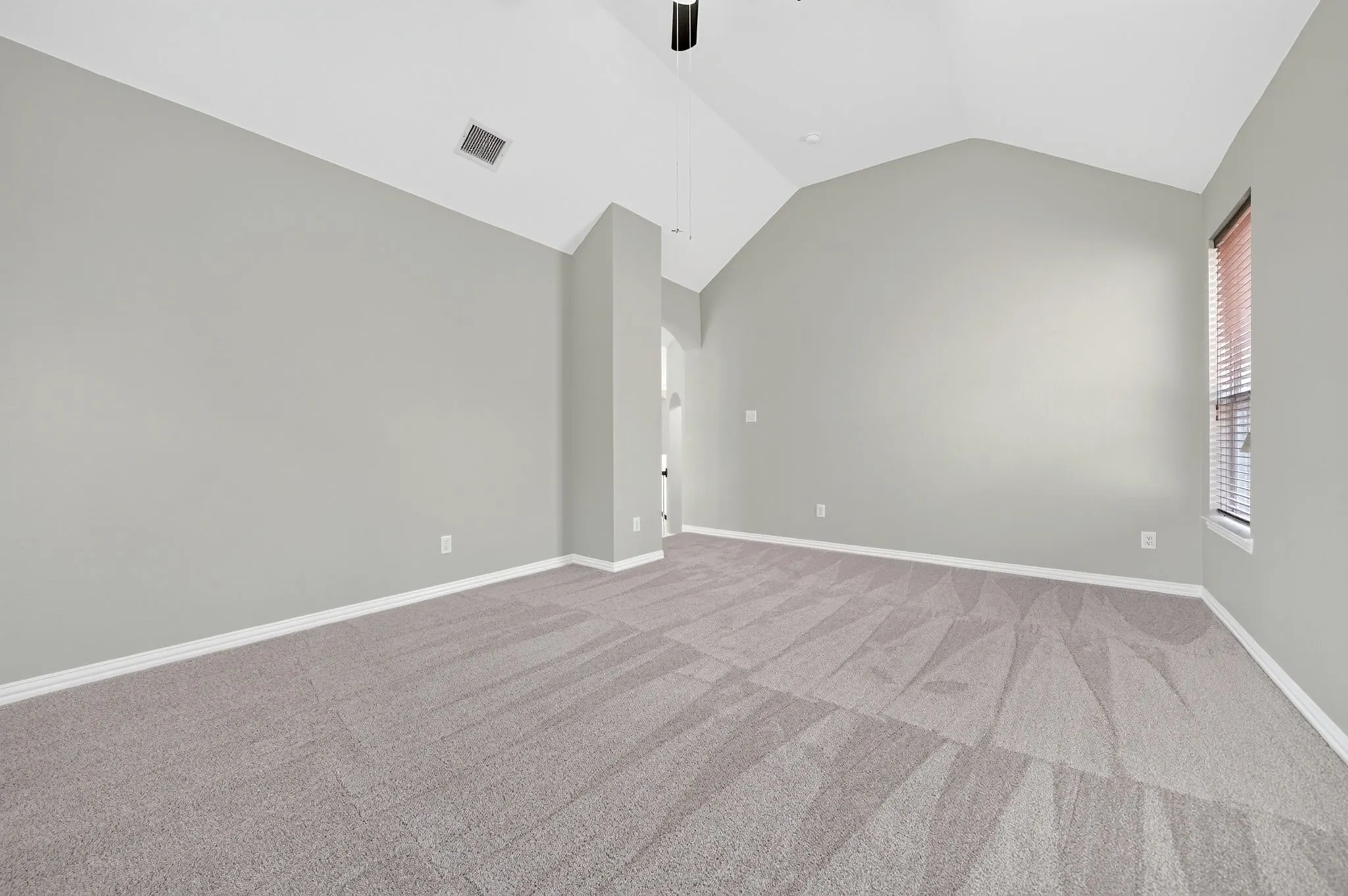 Game room with vaulted ceiling