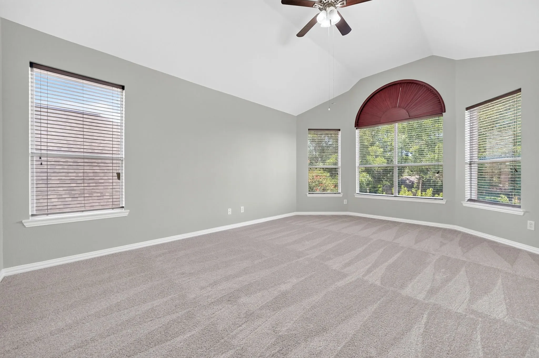 Oversized upstairs game room with multiple windows