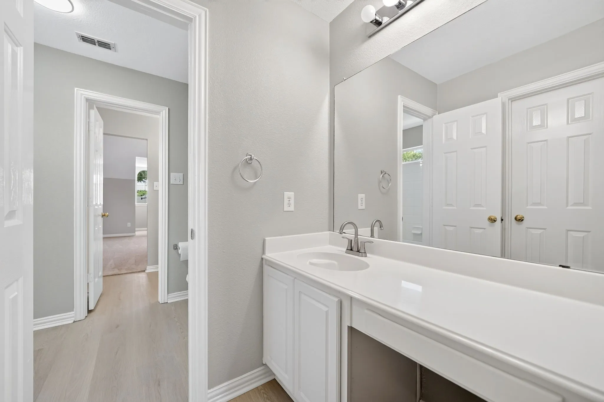 Jack-and-Jill bathroom with separate vanity area
