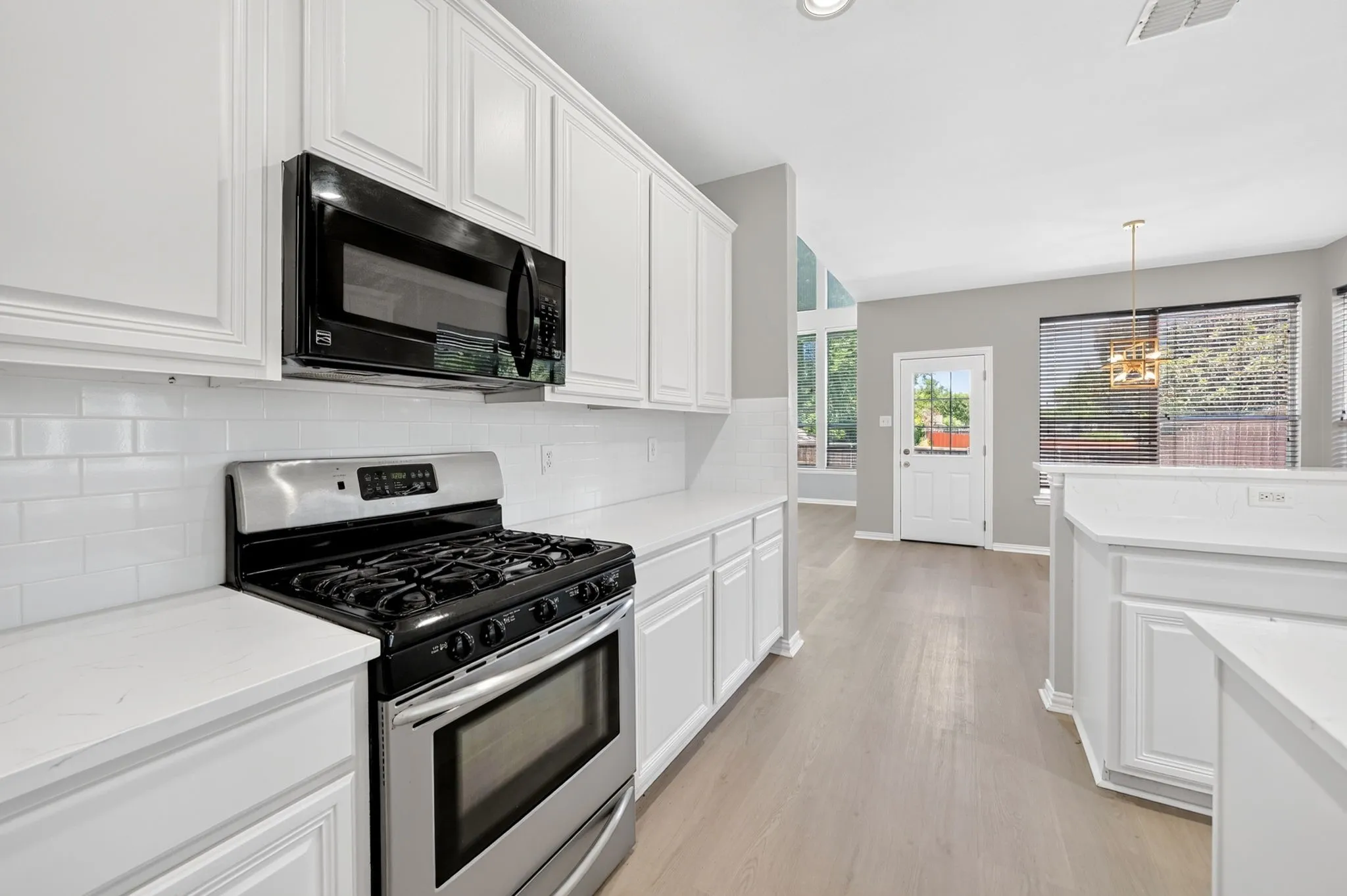 Gas range and subway-tile backsplash