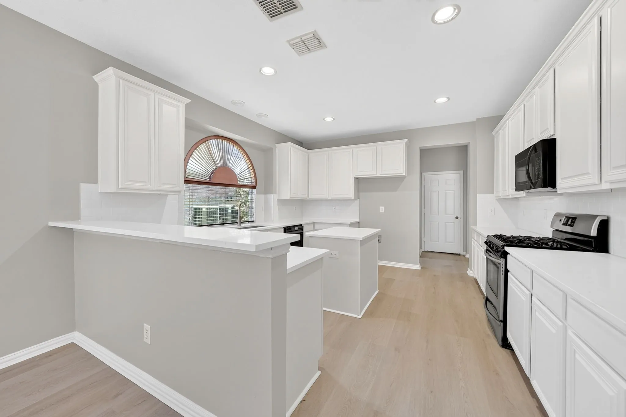 Updated kitchen with quartz countertops and center island