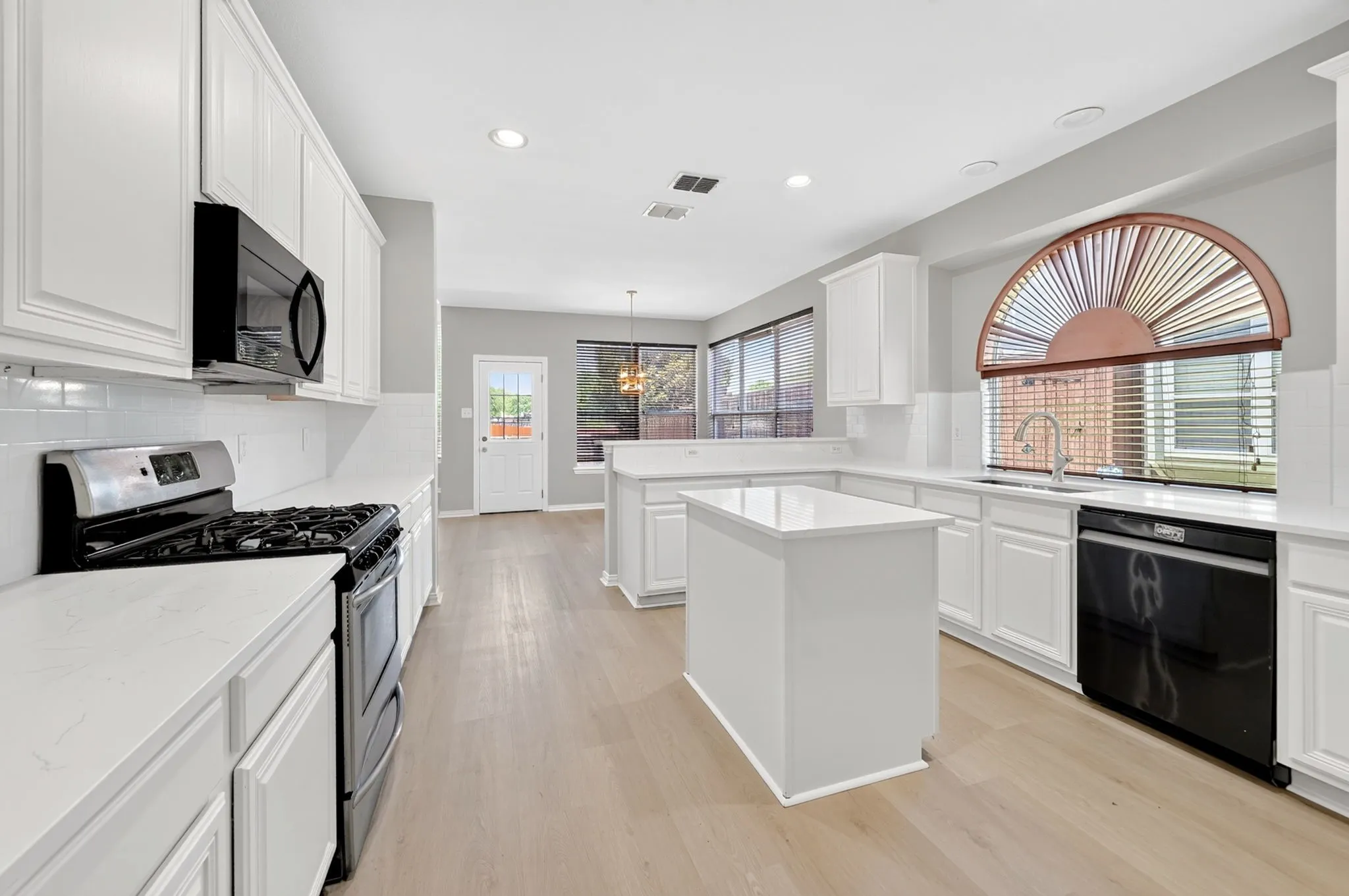 Spacious kitchen with island and breakfast bar