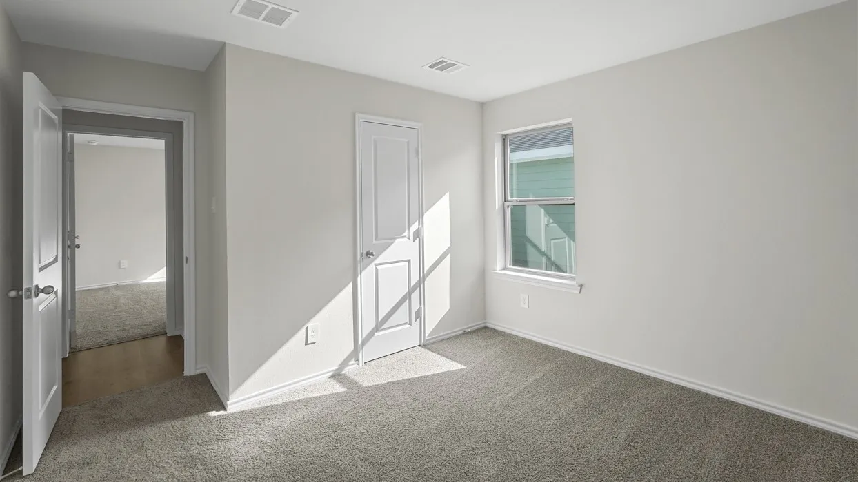 Carpeted room with white painted walls, a single window, and white trim