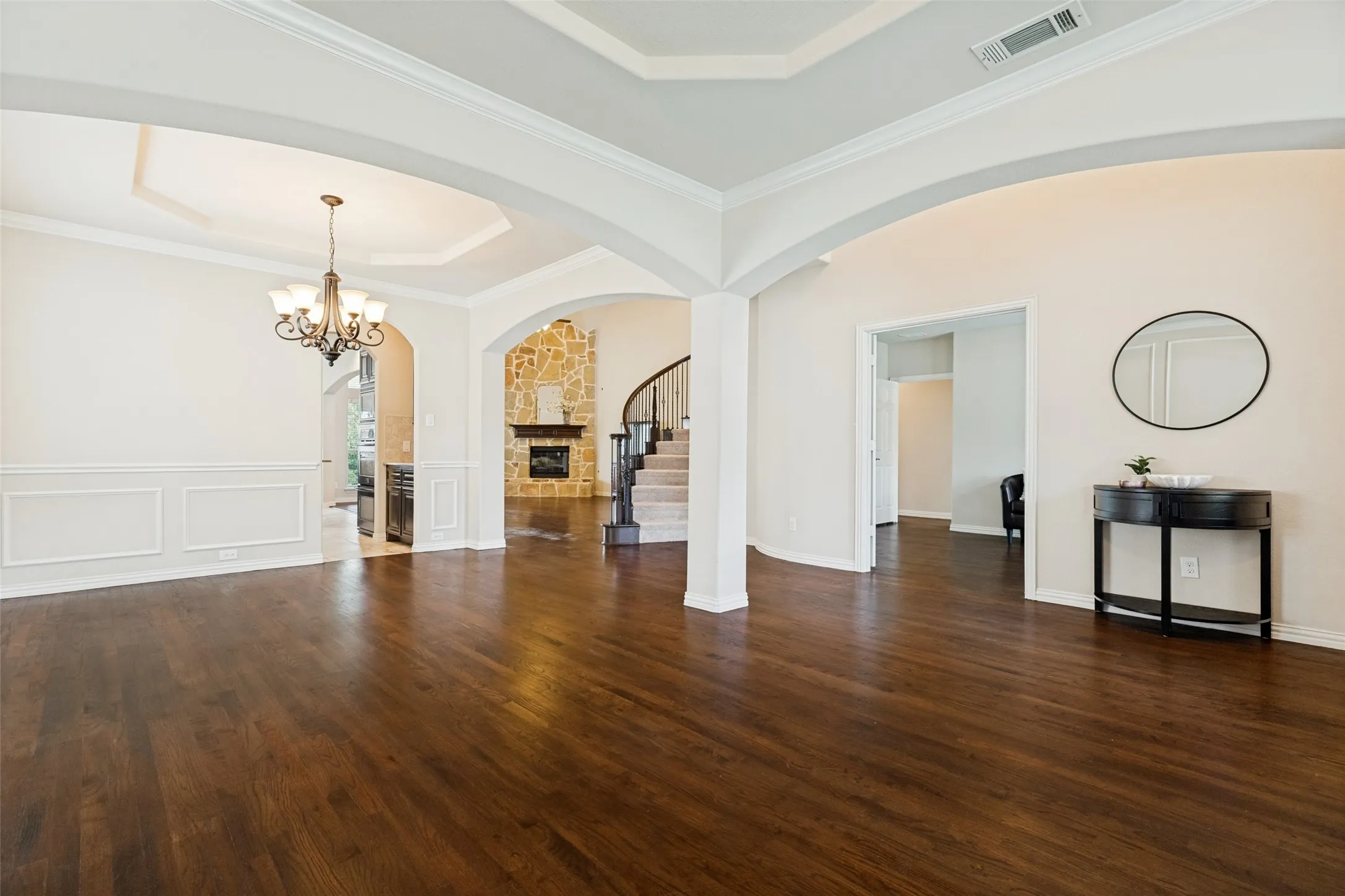 Front Flex Living Space or Sitting area, Wood-finish flooring  and a tray ceiling